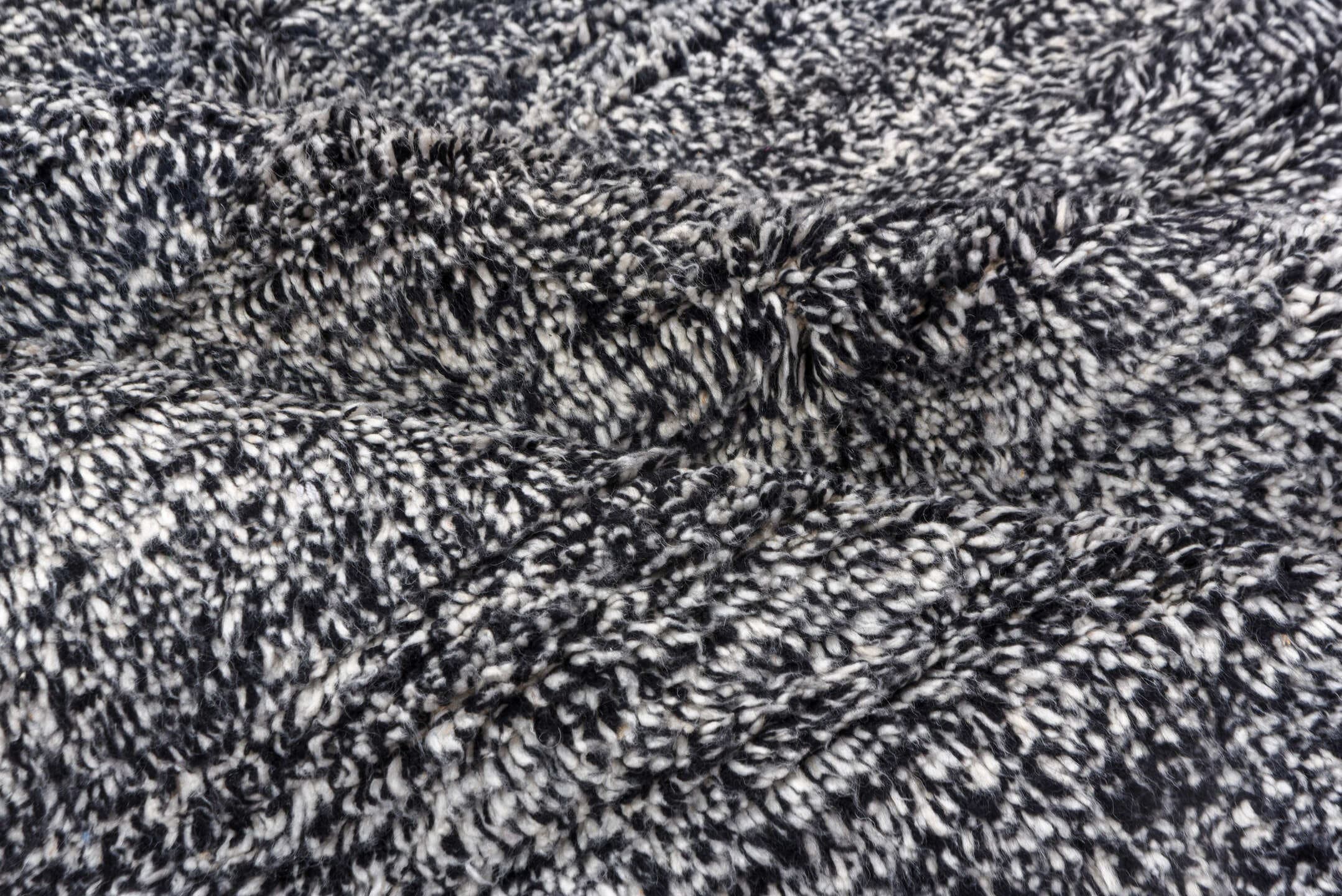 5' x 7' one-of-a-kind handmade vintage Moroccan rug. Color palette: charcoal, ivory, black, cream, gray