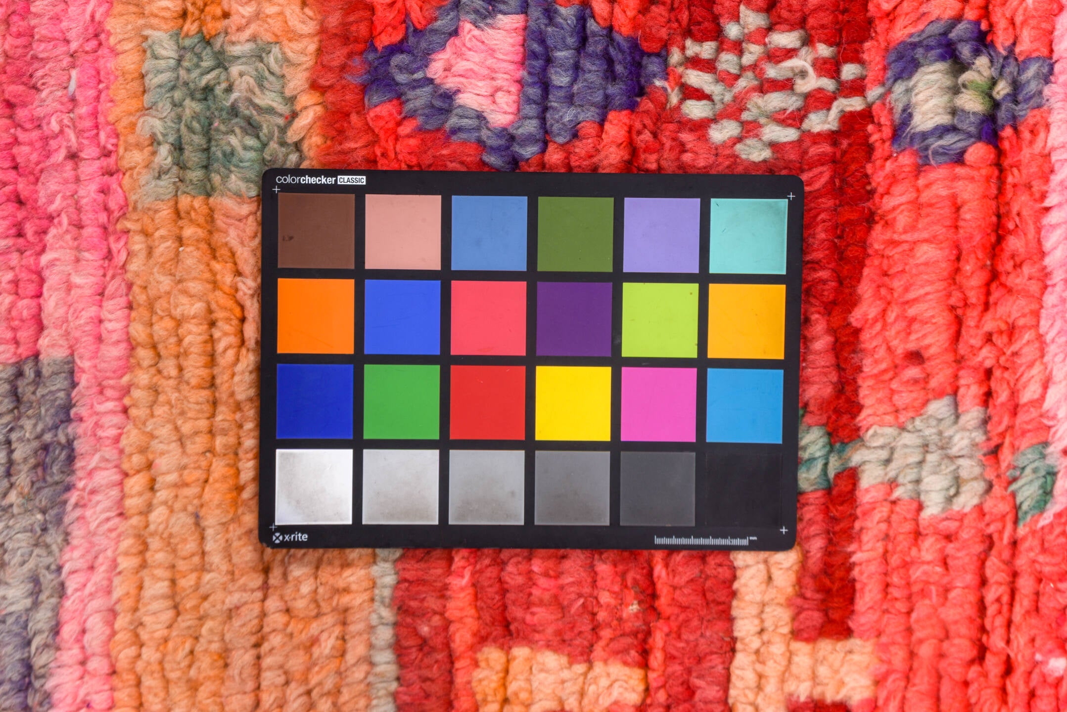 5' x 7' one-of-a-kind handmade vintage Moroccan rug. Color palette: brown, gray, indian red, pink, red