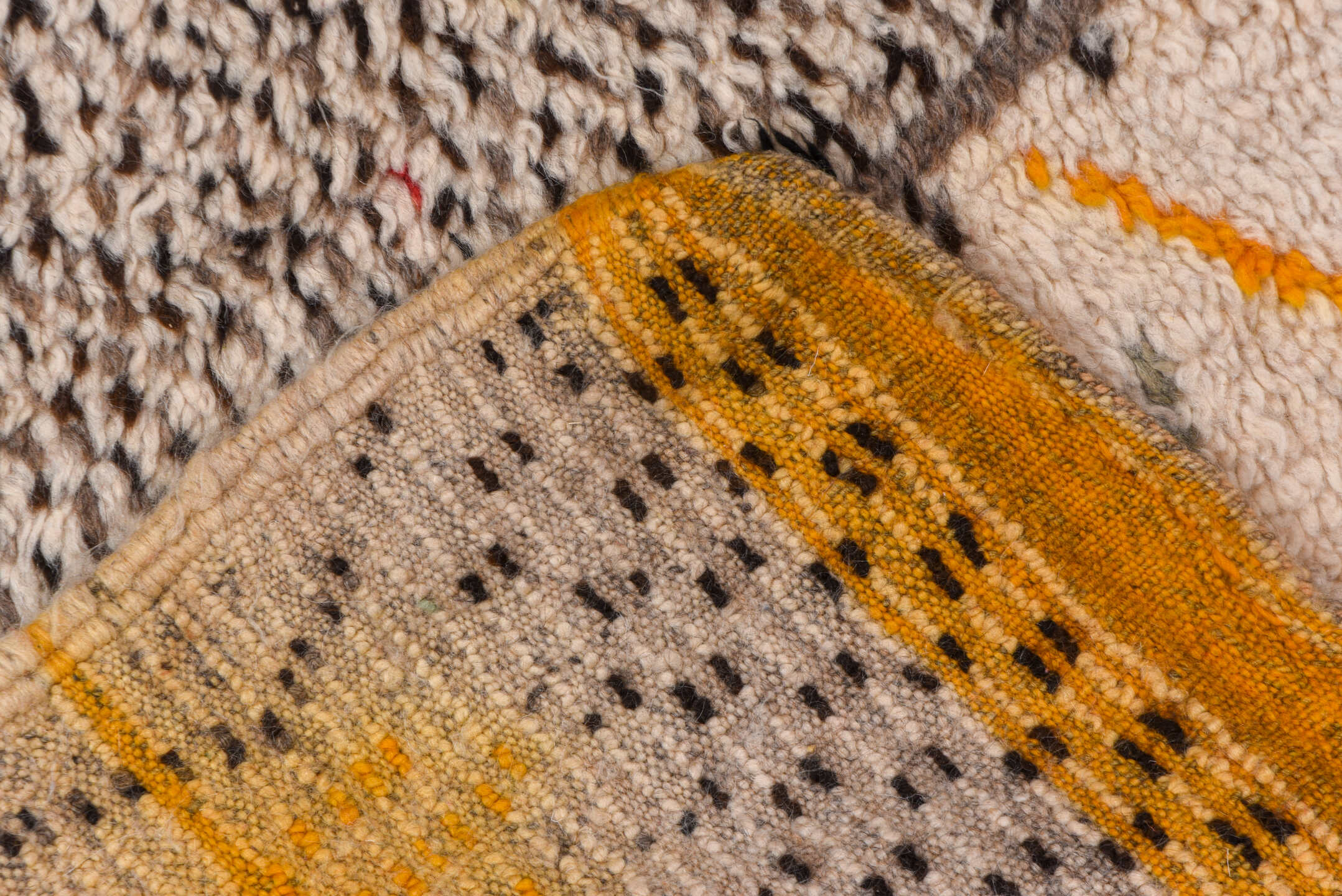 4' x 8' one-of-a-kind handmade vintage Moroccan rug. Color palette: brown, gray, light gray, off-white, orange, peru, pink