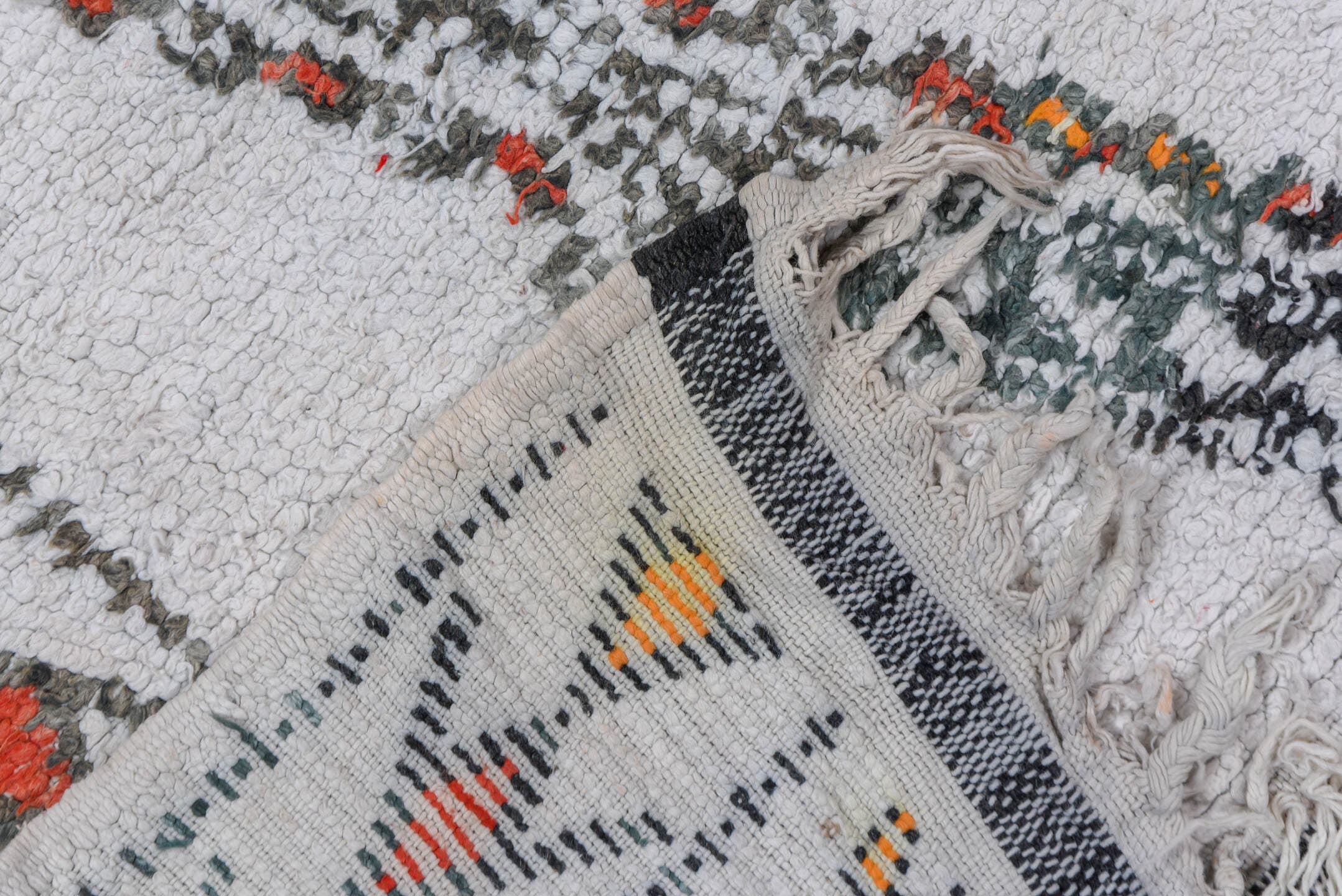5' x 8' one-of-a-kind handmade vintage Moroccan medium size rug. Color palette: ivory, charcoal, rust, saffron, gray, black