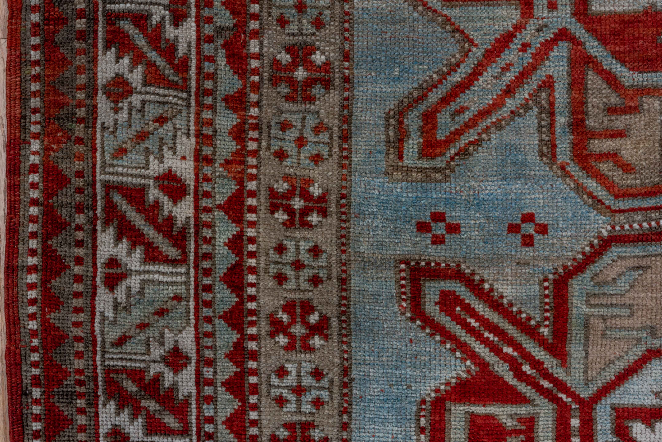 4' x 7' one-of-a-kind handmade antique Kazak rug. Color palette: rust, ivory, sky blue, taupe, brick, camel, terracotta