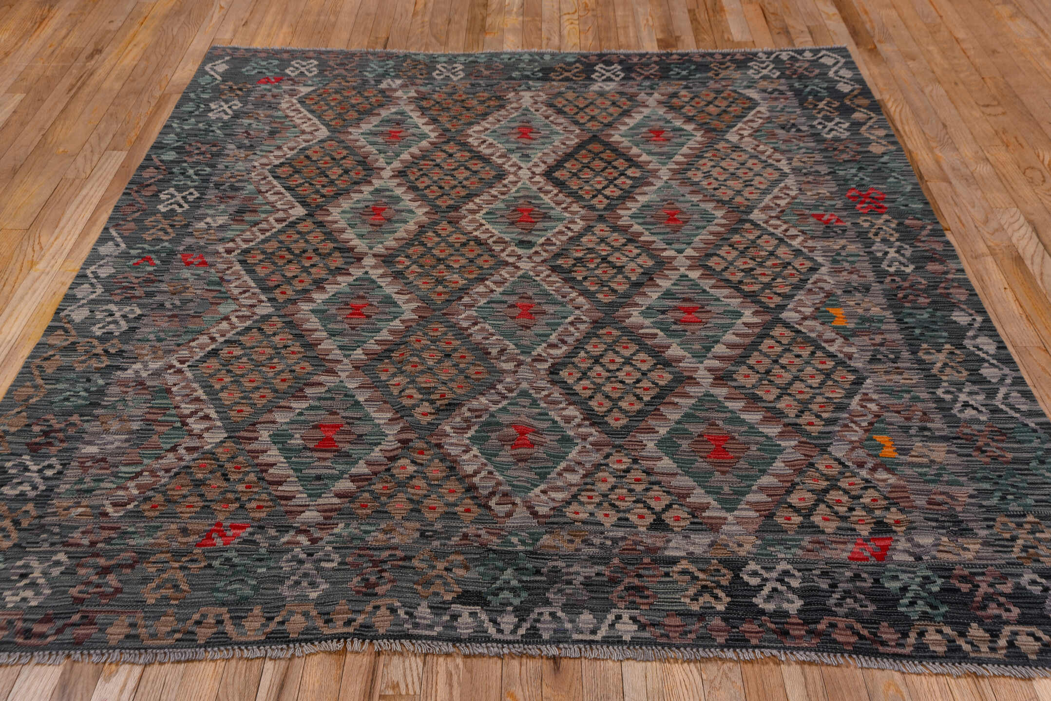 6' x 7' one-of-a-kind handmade vintage Kilim rug. Color palette: black, brown, burgundy, charcoal, dim gray, gray, pink, red