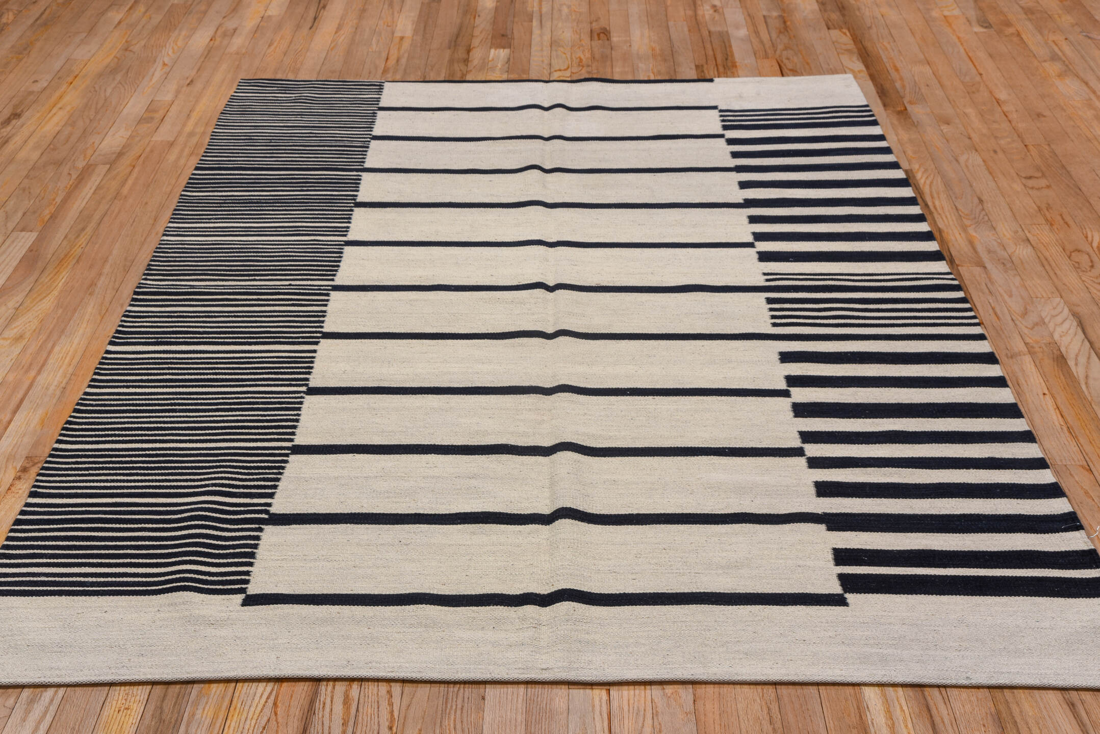 5' x 8' one-of-a-kind handmade vintage Kilim medium size rug. Color palette: black, charcoal, gray, light gray, off-white