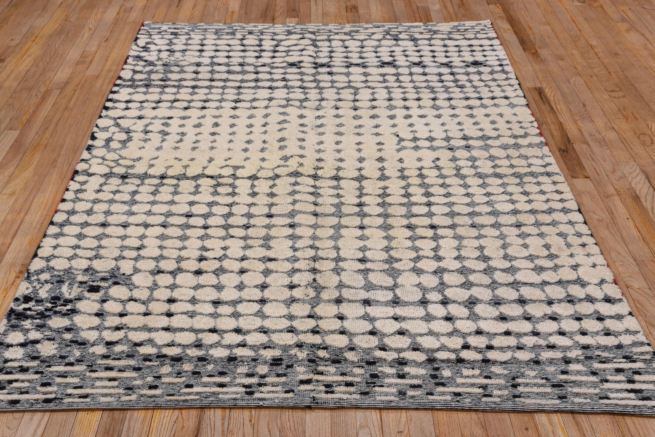 5' x 8' one-of-a-kind handmade handmade Modern medium size rug. Color palette: ivory, slate, charcoal, cream, rose, gray