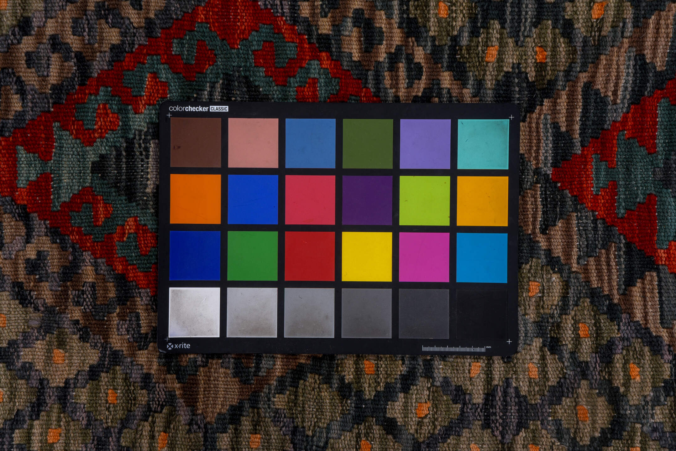 2' x 9' one-of-a-kind handmade vintage Kilim runner rug. Color palette: black, blue, brown, gray, pink, red