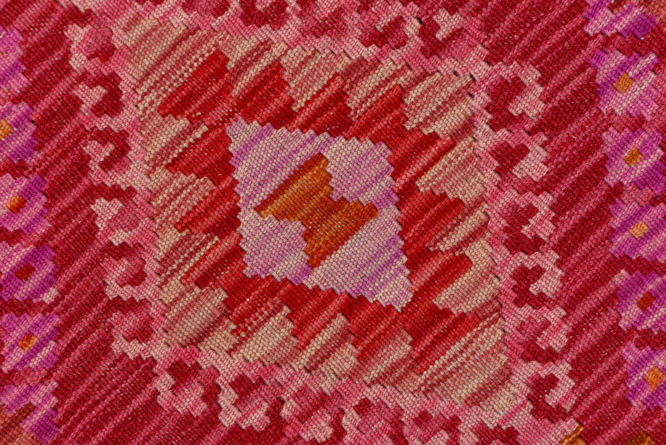 2' x 9' one-of-a-kind handmade vintage Kilim runner rug. Color palette: rose, pink, rust, magenta, terra cotta, ivory