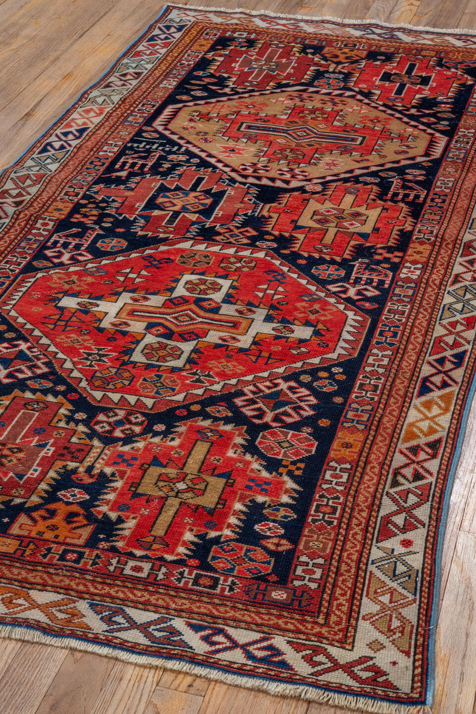 3' x 6' one-of-a-kind handmade antique Shirvan runner rug. Color palette: navy, rust, ivory, camel, crimson, terra cotta