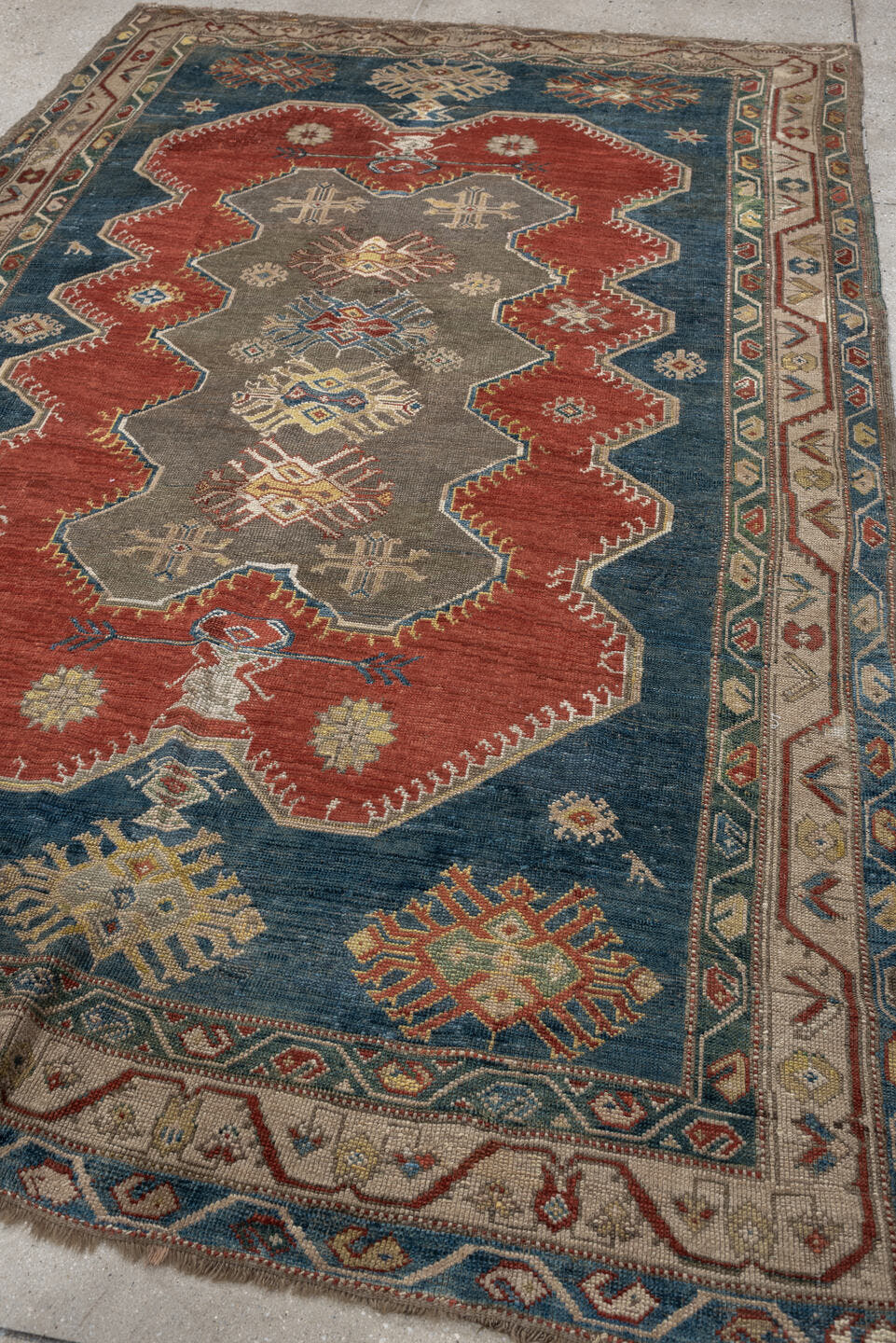 5' x 8' one-of-a-kind handmade antique Caucasian medium size rug. Color palette: teal, rust, ivory, taupe, terracotta, ochre