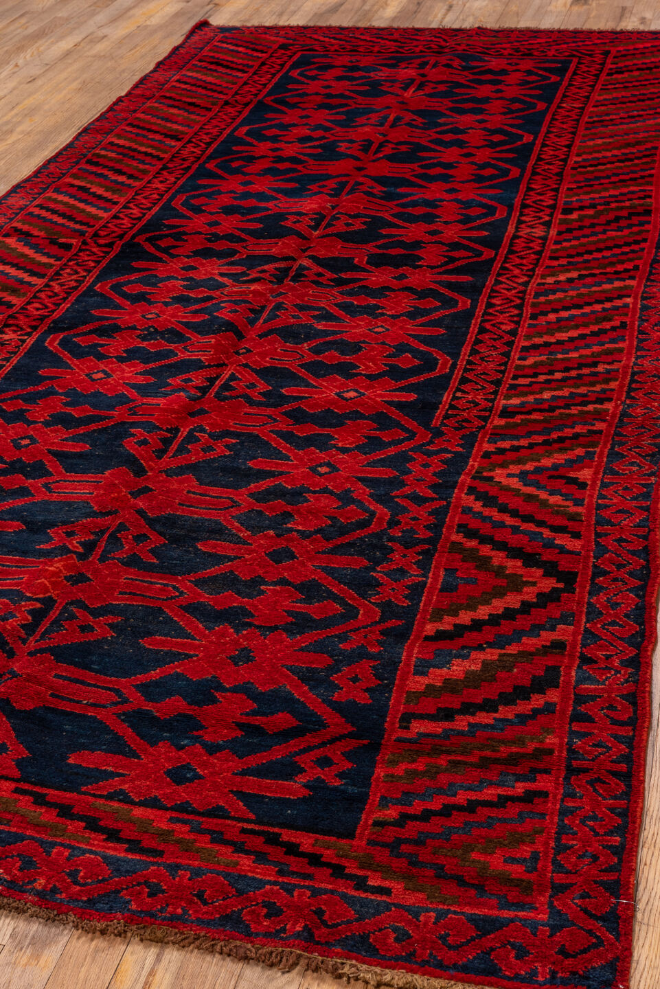 4' x 10' one-of-a-kind handmade vintage Khotan runner rug. Color palette: black, brown, pink, red