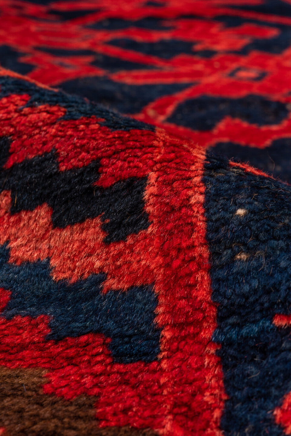 4' x 10' one-of-a-kind handmade vintage Khotan runner rug. Color palette: black, brown, pink, red