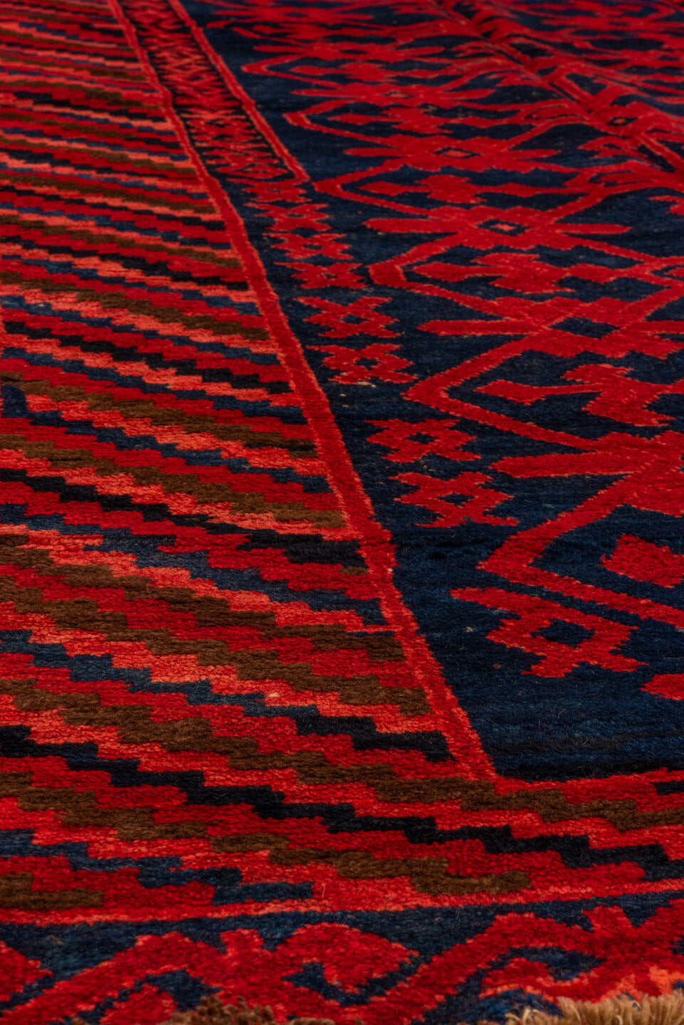 4' x 10' one-of-a-kind handmade antique Khotan runner rug. Color palette: crimson, navy, burgundy, indigo, red, blue, purple
