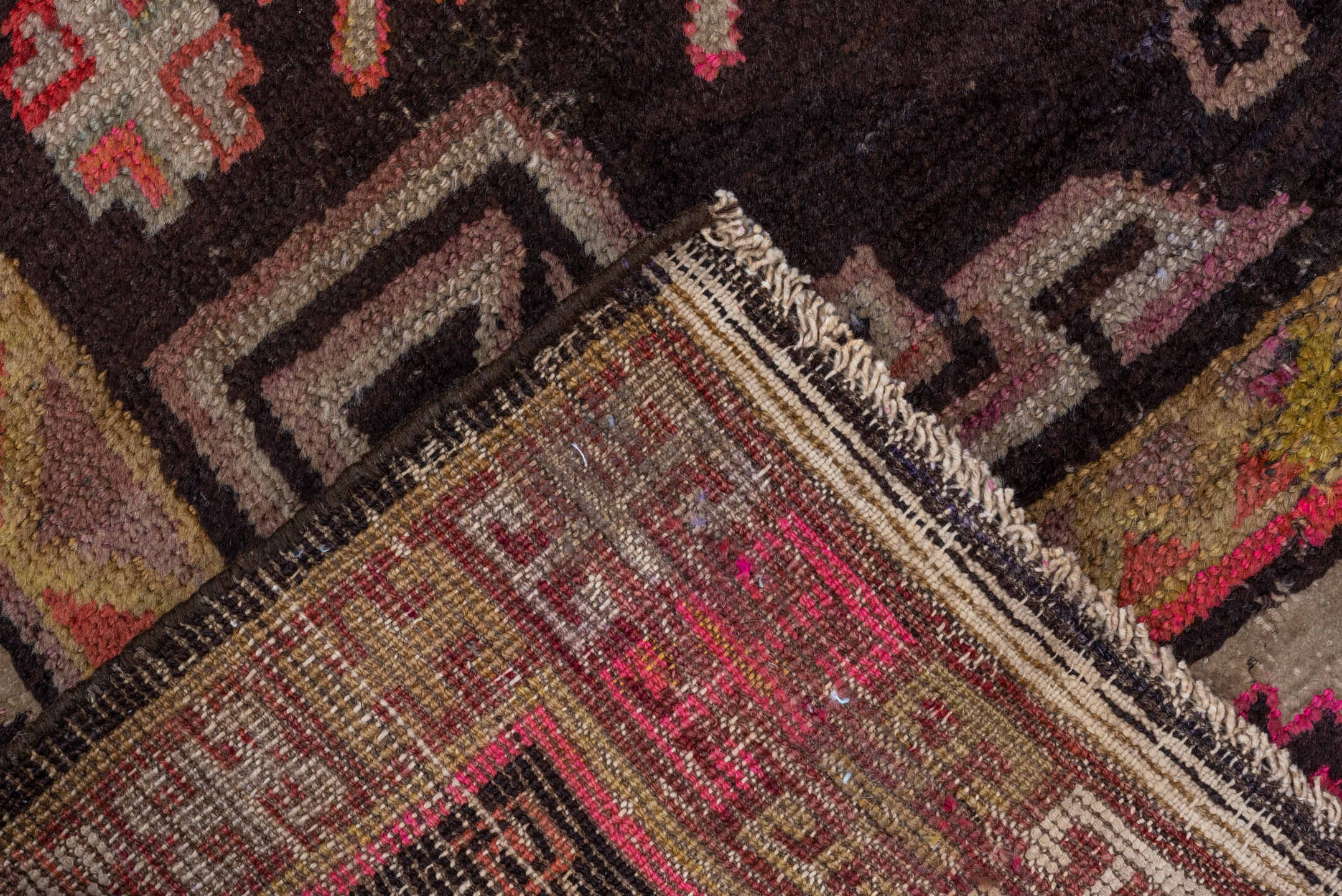 5' x 8' one-of-a-kind handmade vintage Khotan medium size rug. Color palette: black, brown, gray, pink, red