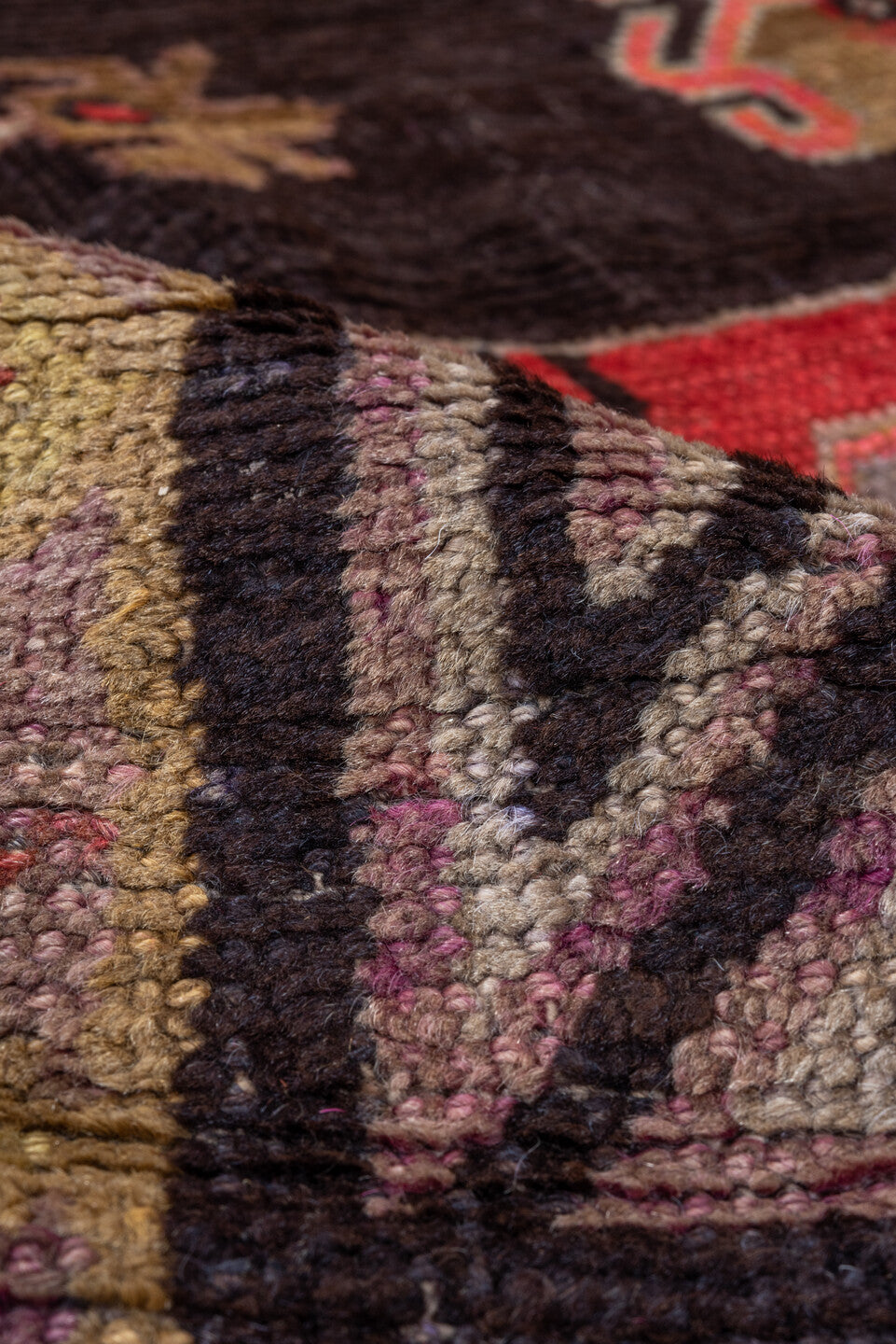 5' x 8' one-of-a-kind handmade vintage Khotan medium size rug. Color palette: black, brown, gray, pink, red