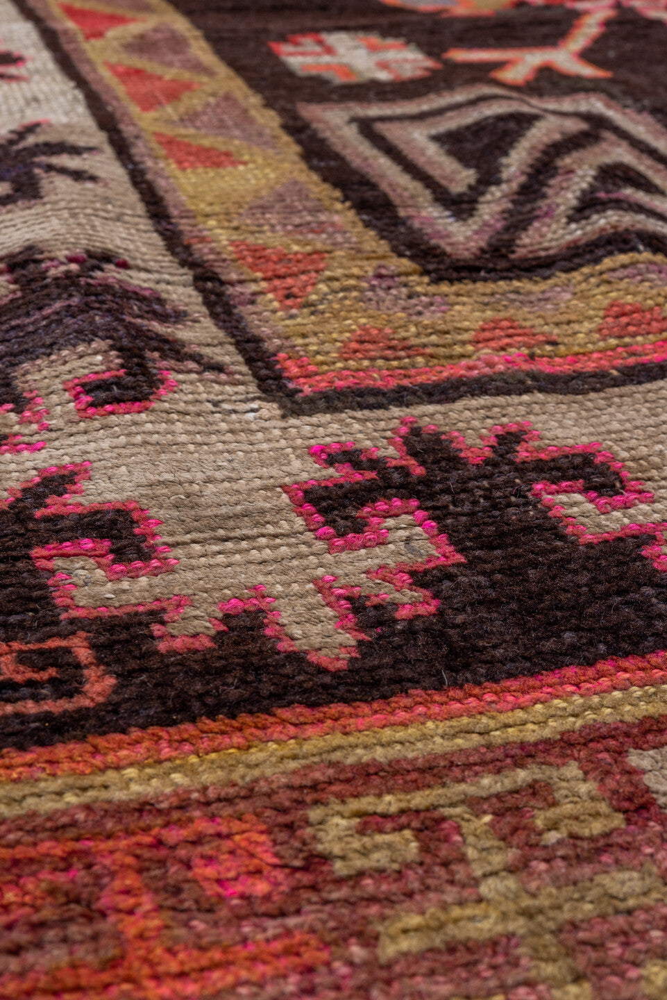 5' x 8' one-of-a-kind handmade vintage Khotan medium size rug. Color palette: black, brown, gray, pink, red