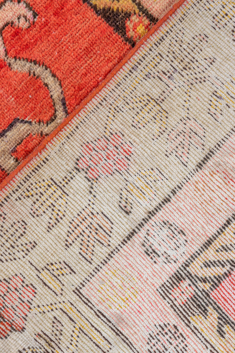 4' x 8' one-of-a-kind handmade vintage Khotan rug. Color palette: brown, dark salmon, orange, pink, red, yellow
