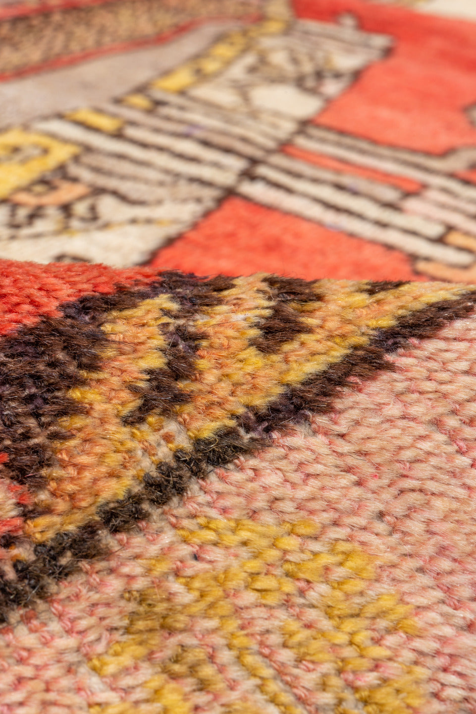 4' x 8' one-of-a-kind handmade vintage Khotan rug. Color palette: brown, dark salmon, orange, pink, red, yellow