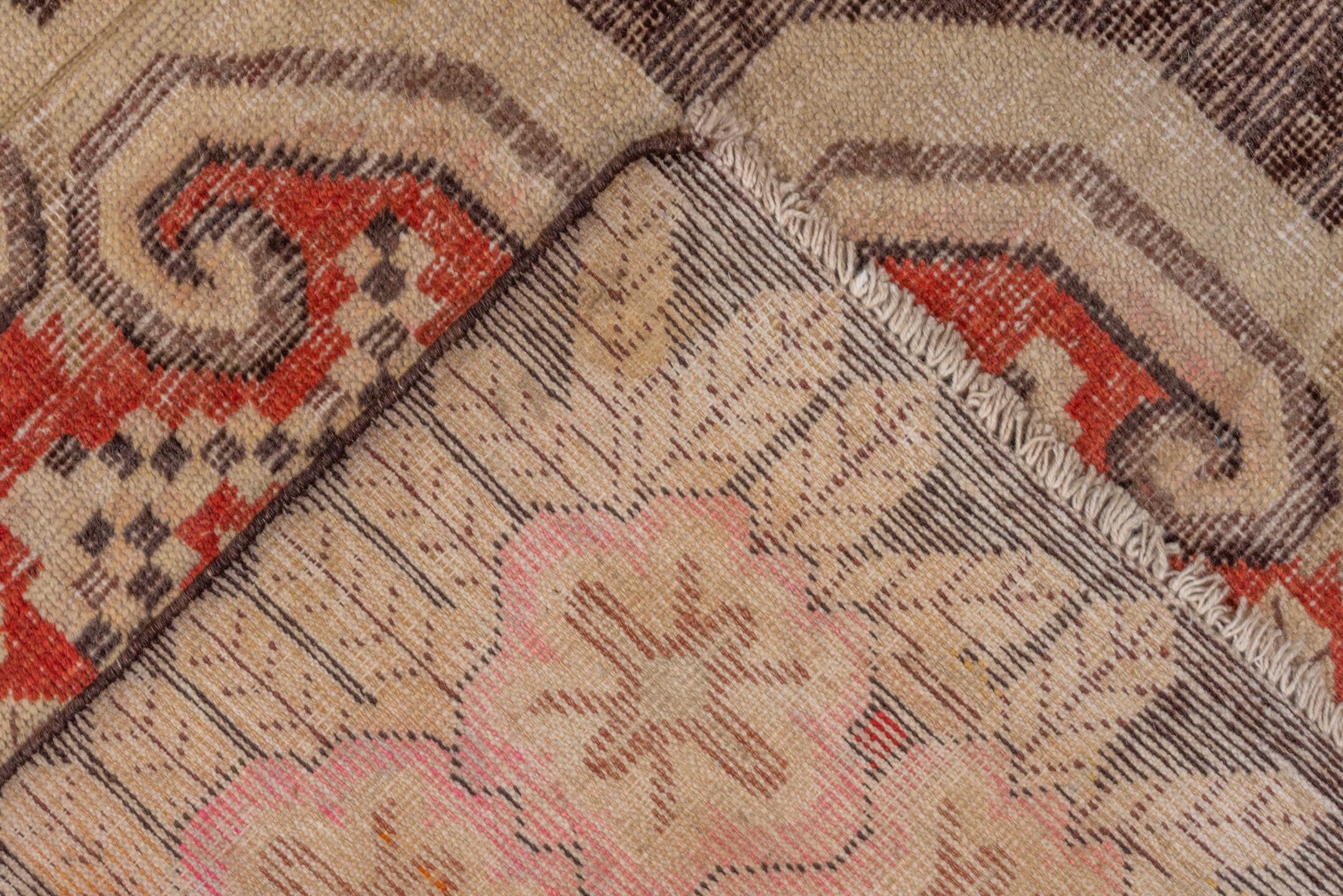 5' x 8' one-of-a-kind handmade vintage Khotan medium size rug. Color palette: brown, dark red, off-white, orange, red, tan