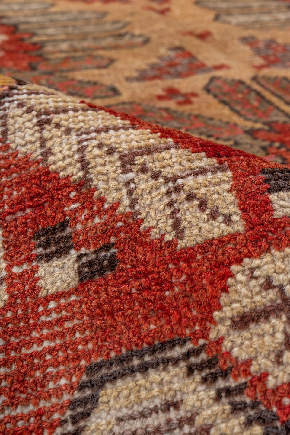 5' x 8' one-of-a-kind handmade vintage Khotan medium size rug. Color palette: brown, dark red, off-white, orange, red, tan
