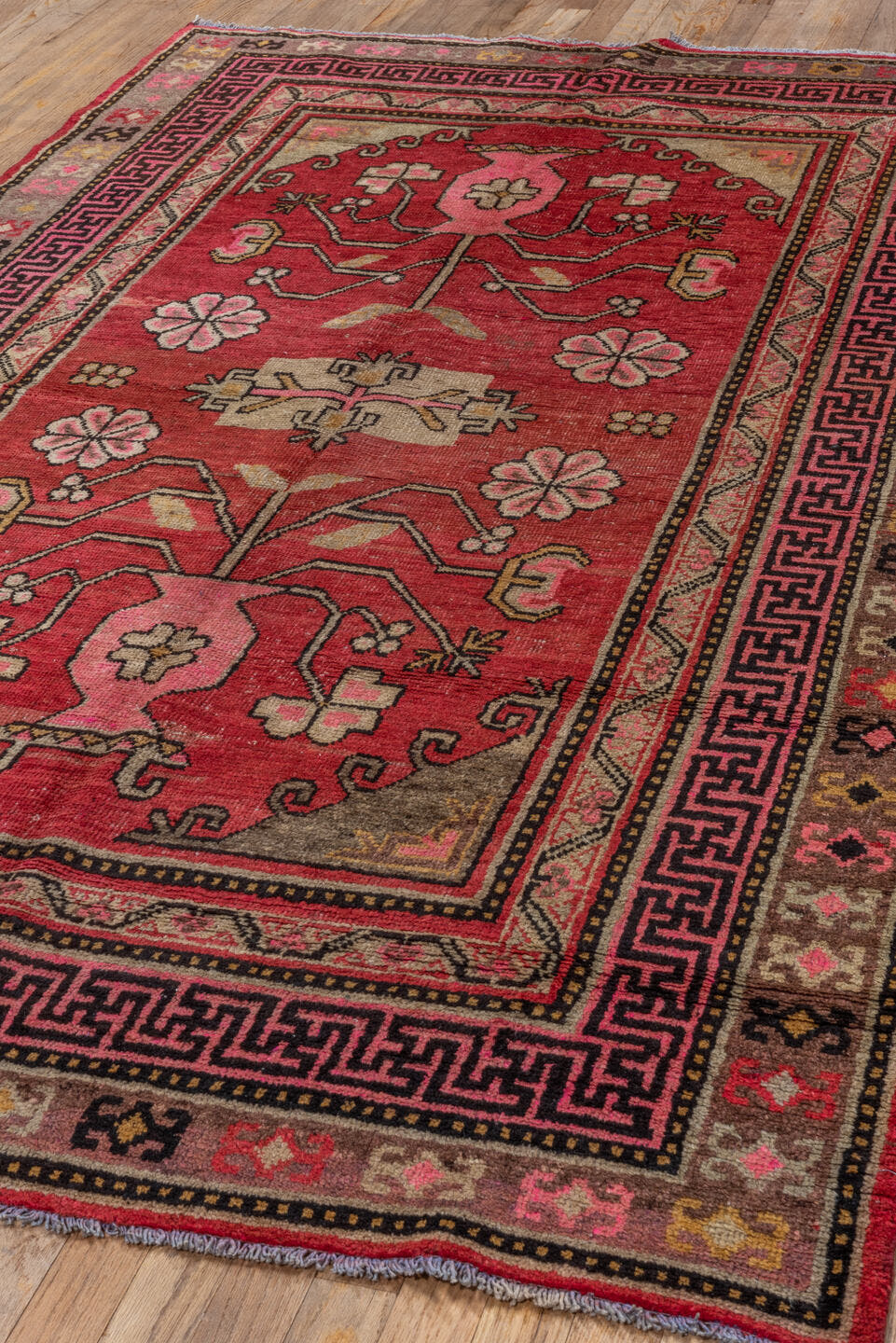4' x 8' one-of-a-kind handmade antique Khotan rug. Color palette: raspberry, rose, taupe, ivory, charcoal, burgundy, camel