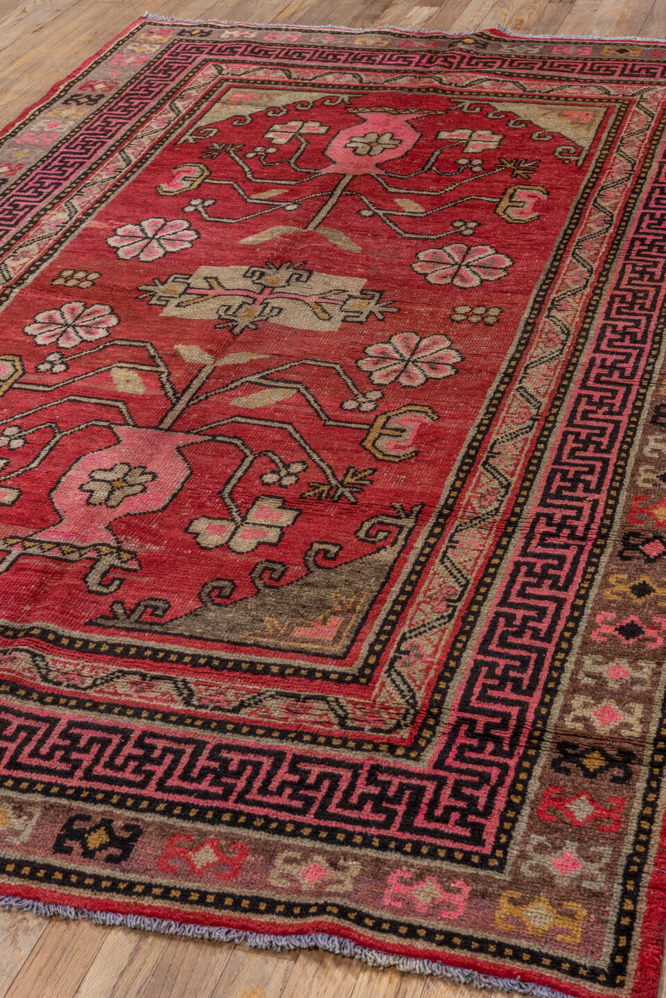 4' x 8' one-of-a-kind handmade antique Khotan rug. Color palette: raspberry, rose, taupe, ivory, charcoal, burgundy, camel