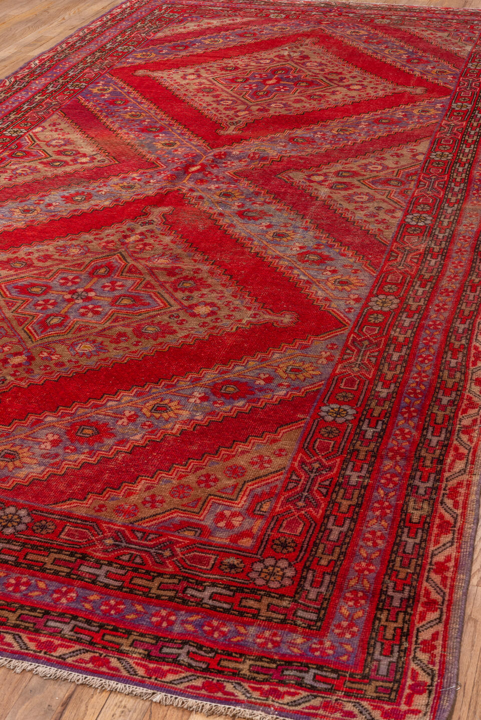 5' x 12' one-of-a-kind handmade antique Khotan rug. Color palette: red, crimson, rose, lavender, ivory, taupe, charcoal