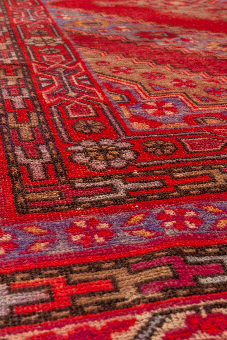 5' x 12' one-of-a-kind handmade antique Khotan rug. Color palette: red, crimson, rose, lavender, ivory, taupe, charcoal