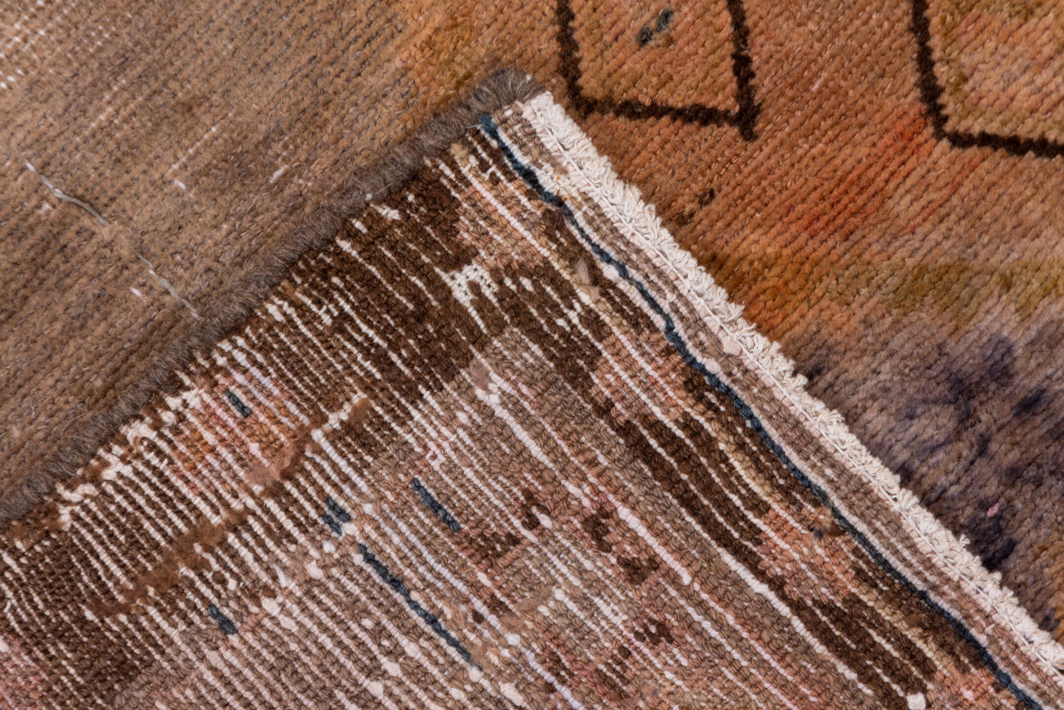 4' x 9' one-of-a-kind handmade vintage Distressed runner rug. Color palette: taupe, terra cotta, brown, charcoal, camel
