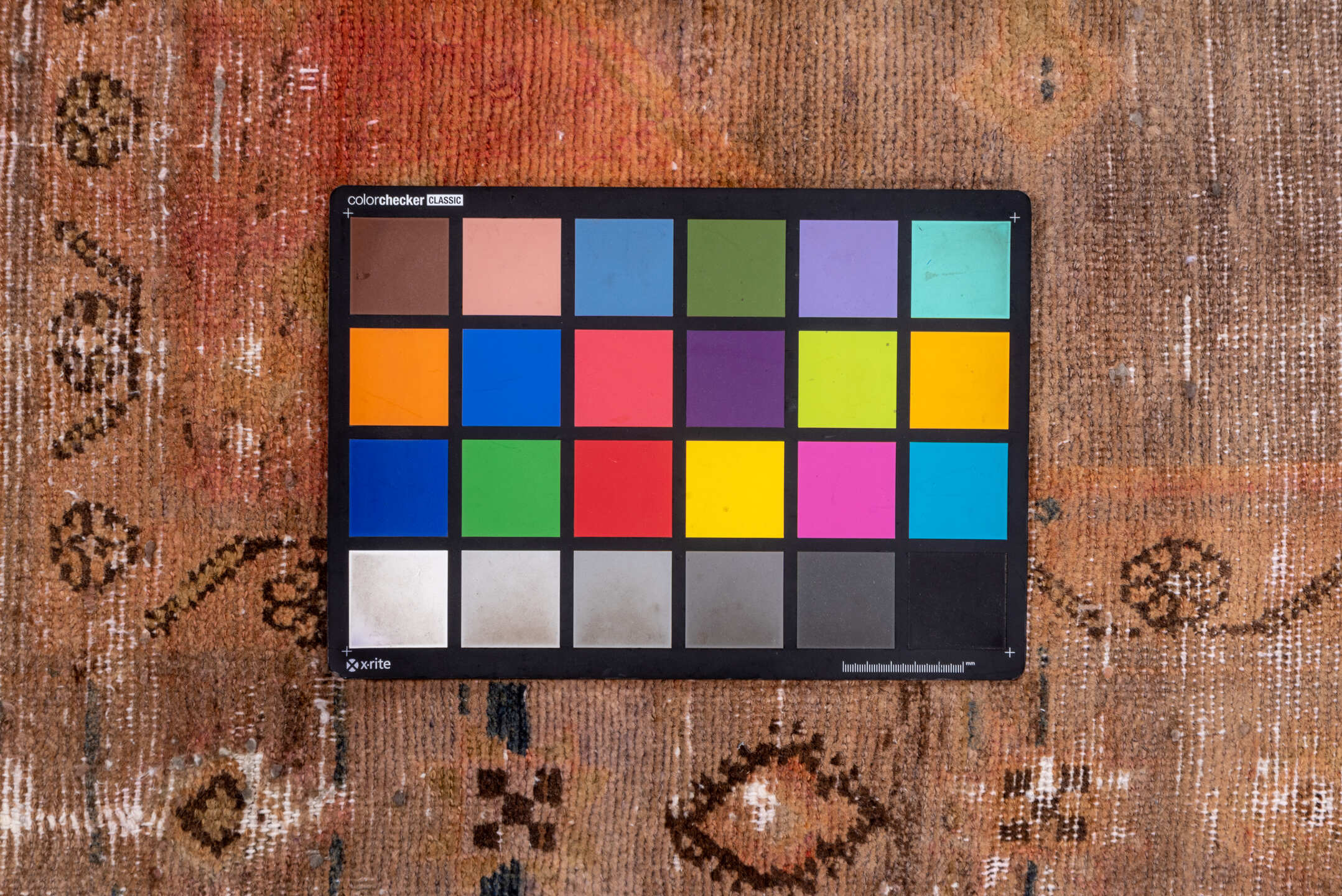 4' x 9' one-of-a-kind handmade vintage Distressed runner rug. Color palette: black, brown, charcoal, gray, light gray