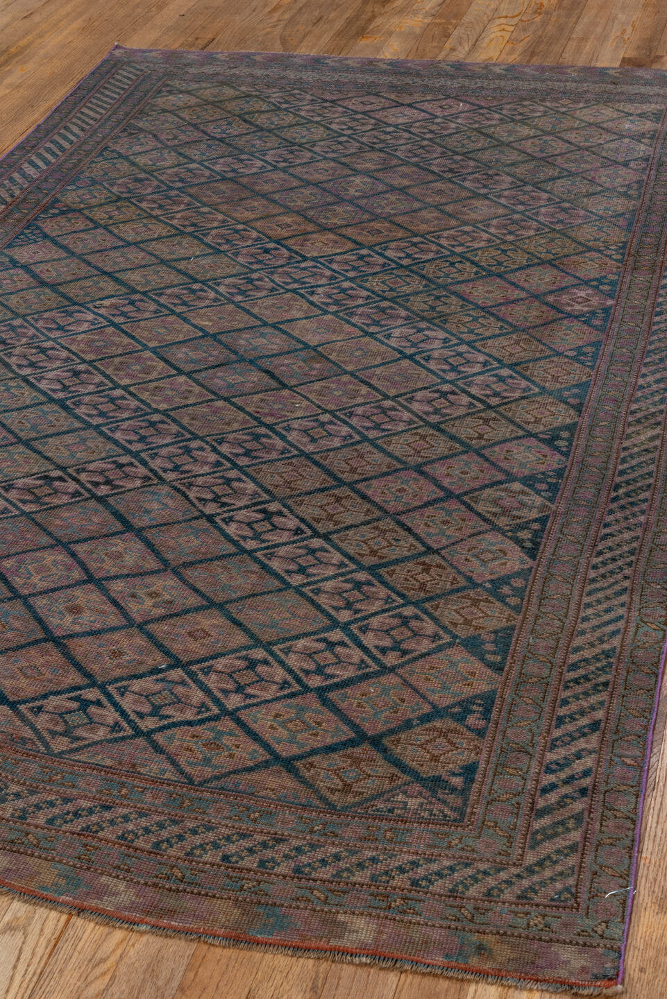 4' x 7' one-of-a-kind handmade antique Qashqai rug. Color palette: taupe, indigo, mauve, dusty rose, ivory, slate, camel