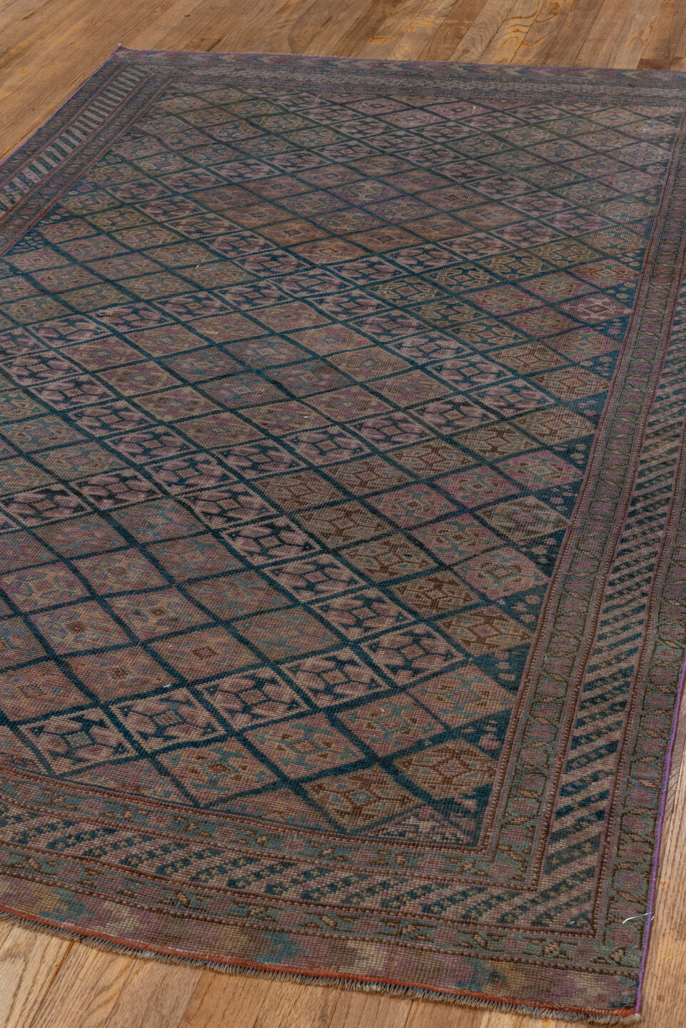 4' x 7' one-of-a-kind handmade antique Qashqai rug. Color palette: taupe, indigo, mauve, dusty rose, ivory, slate, camel