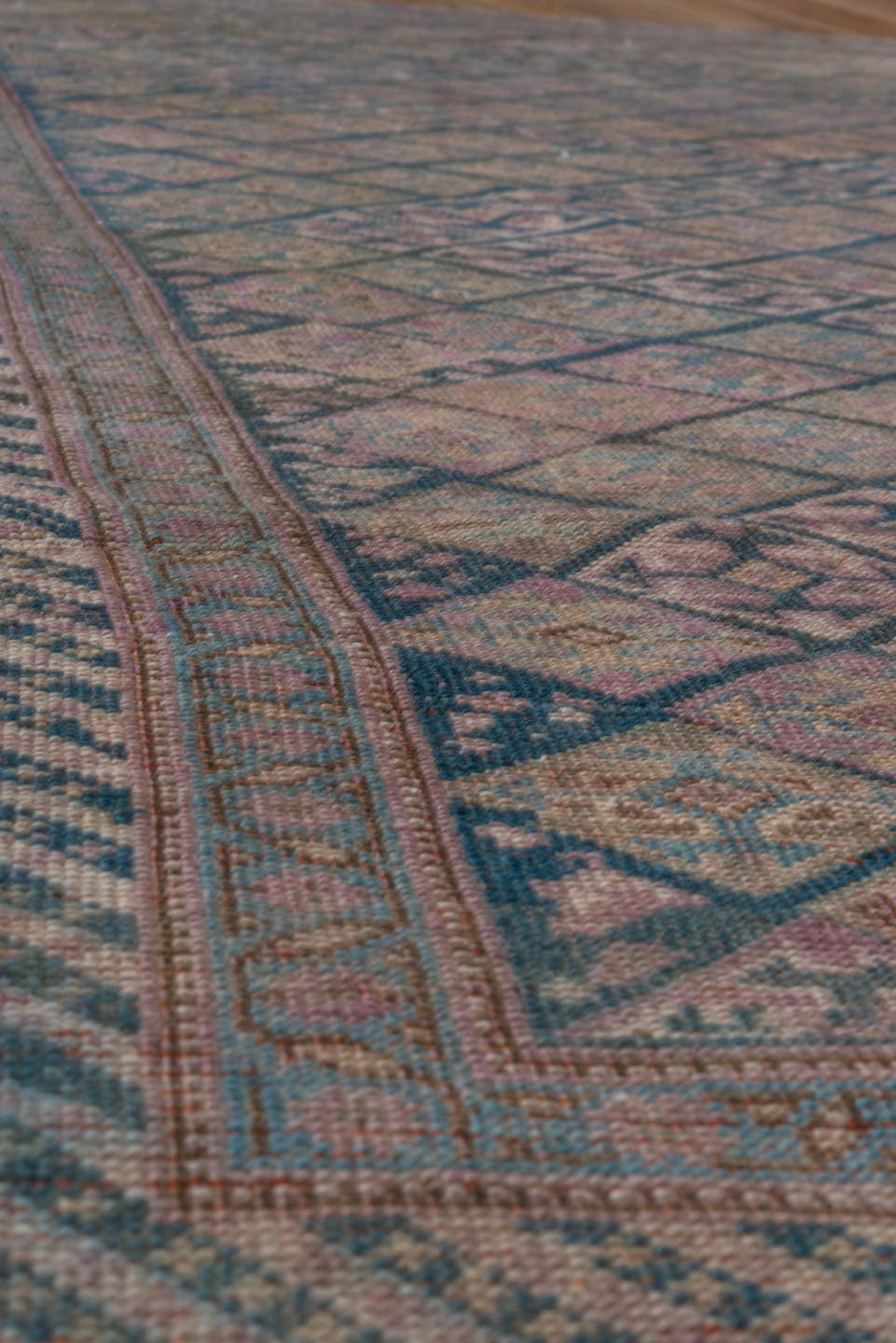4' x 7' one-of-a-kind handmade antique Qashqai rug. Color palette: taupe, indigo, mauve, dusty rose, ivory, slate, camel