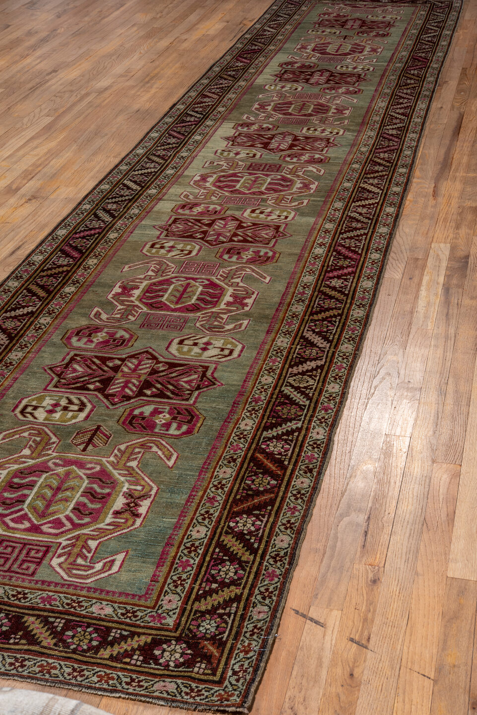 3' x 17' one-of-a-kind handmade vintage Caucasian runner rug. Color palette: brown, gray, off-white, red, snow, white