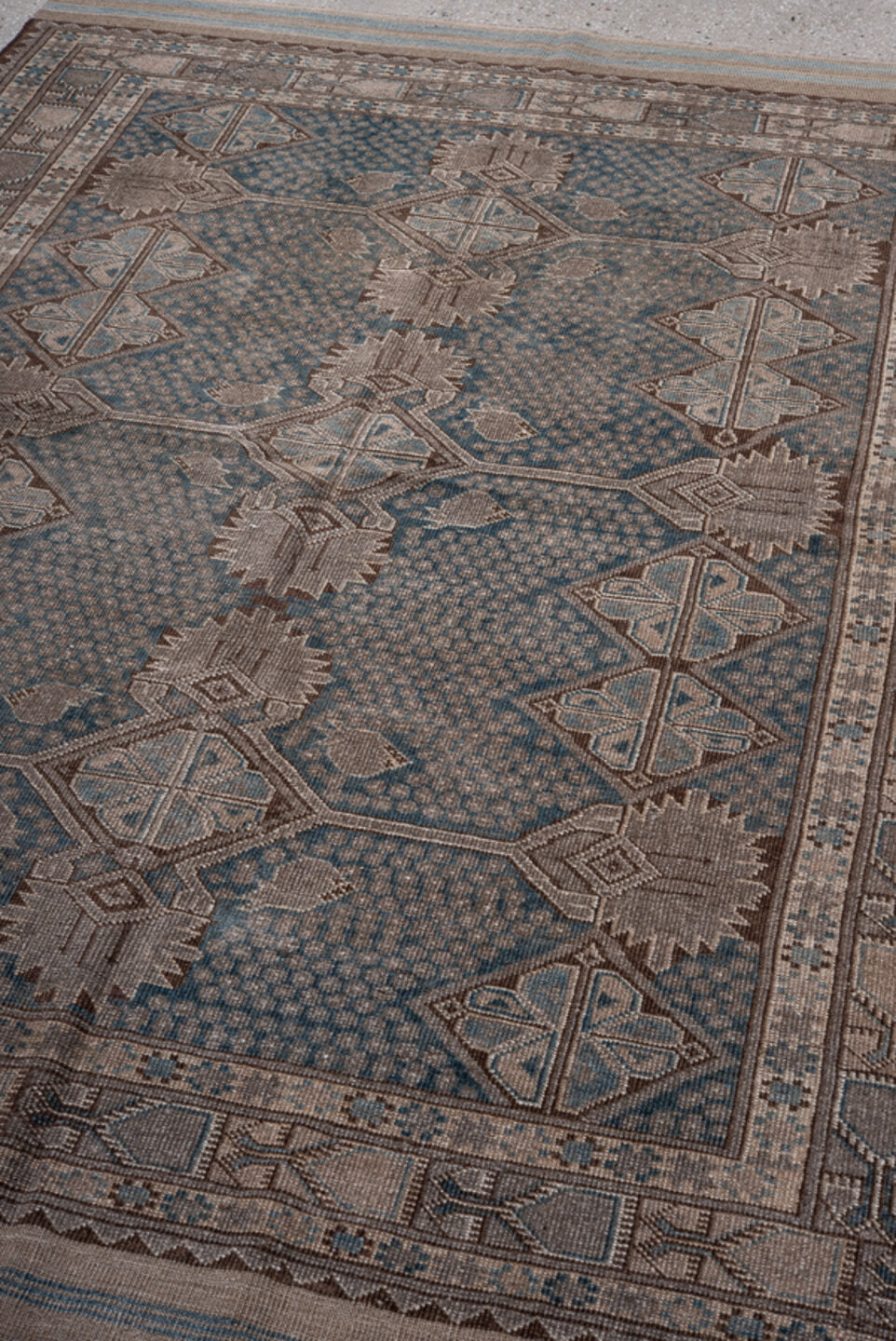 5' x 7' one-of-a-kind handmade vintage Belouch rug. Color palette: black, blue, brown, charcoal, gray, light gray, pink