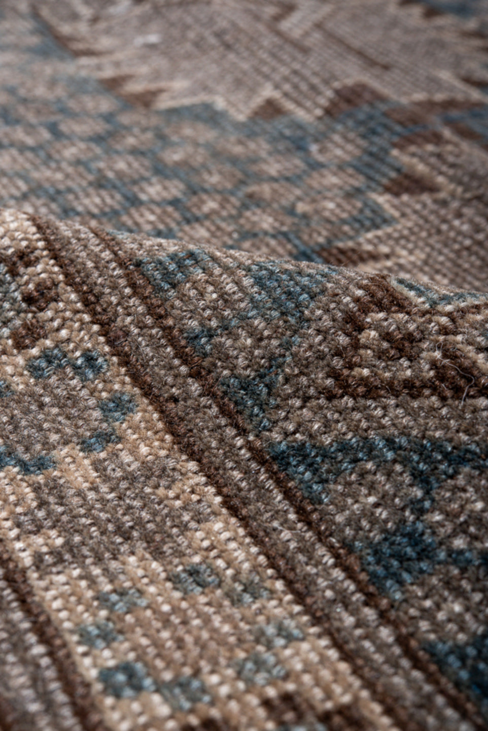 5' x 7' one-of-a-kind handmade vintage Belouch rug. Color palette: black, blue, brown, charcoal, gray, light gray, pink