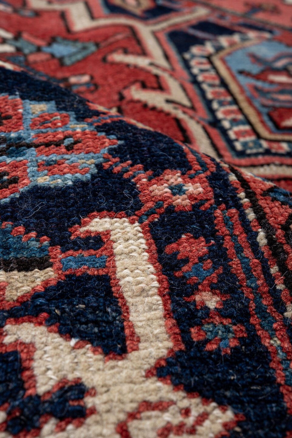 7' x 10' one-of-a-kind handmade antique Heriz large size rug. Color palette: rust, navy, ivory, sky_blue, coral, camel