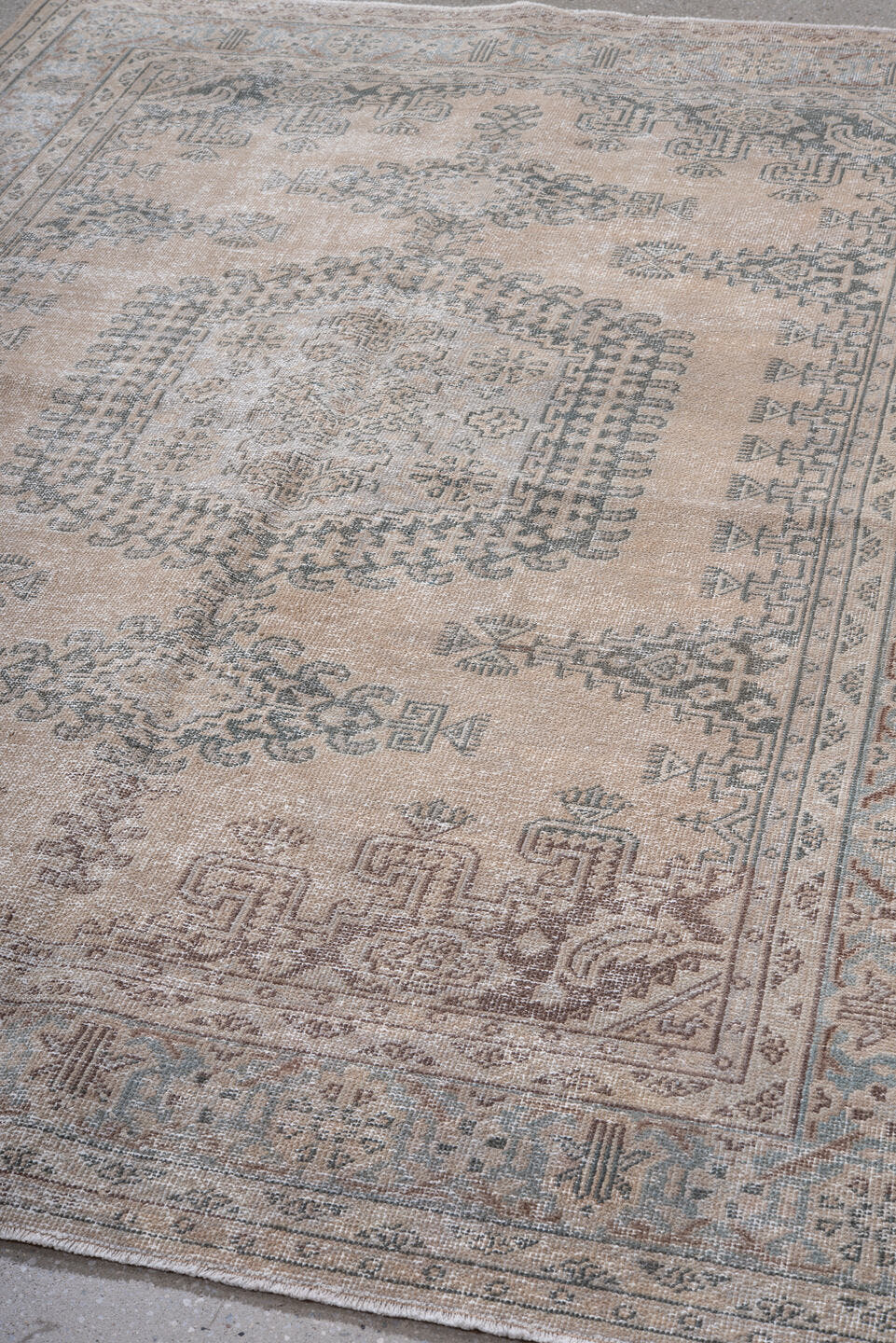 5' x 7' one-of-a-kind handmade antique Veece rug. Color palette: beige, ivory, taupe, slate, pale blue, brown, gray