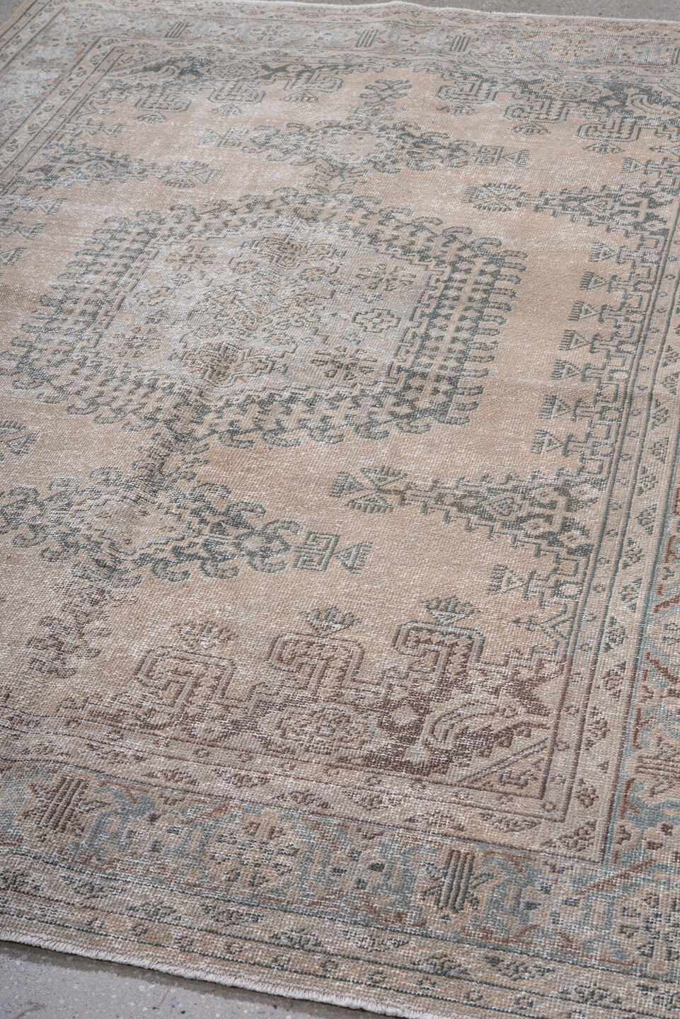5' x 7' one-of-a-kind handmade antique Veece rug. Color palette: beige, ivory, taupe, slate, pale blue, brown, gray