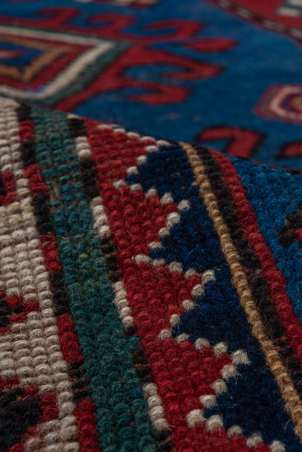 3' x 6' one-of-a-kind handmade antique Kazak small size rug. Color palette: blue, rust, ivory, navy, crimson, gold, teal