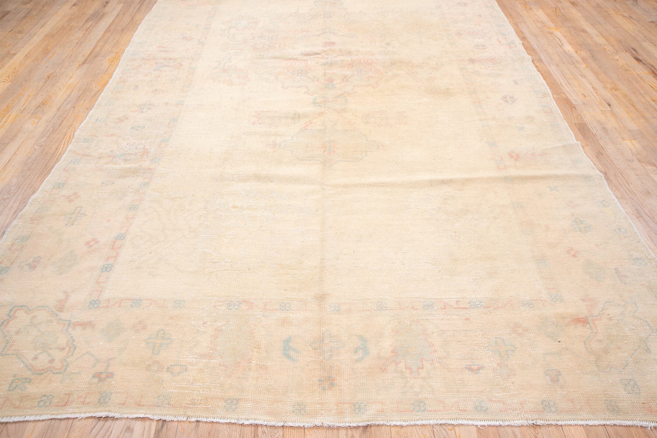 7' x 14' one-of-a-kind handmade antique Oushak large size rug. Color palette: apricot, ivory, peach, sage, taupe, rose