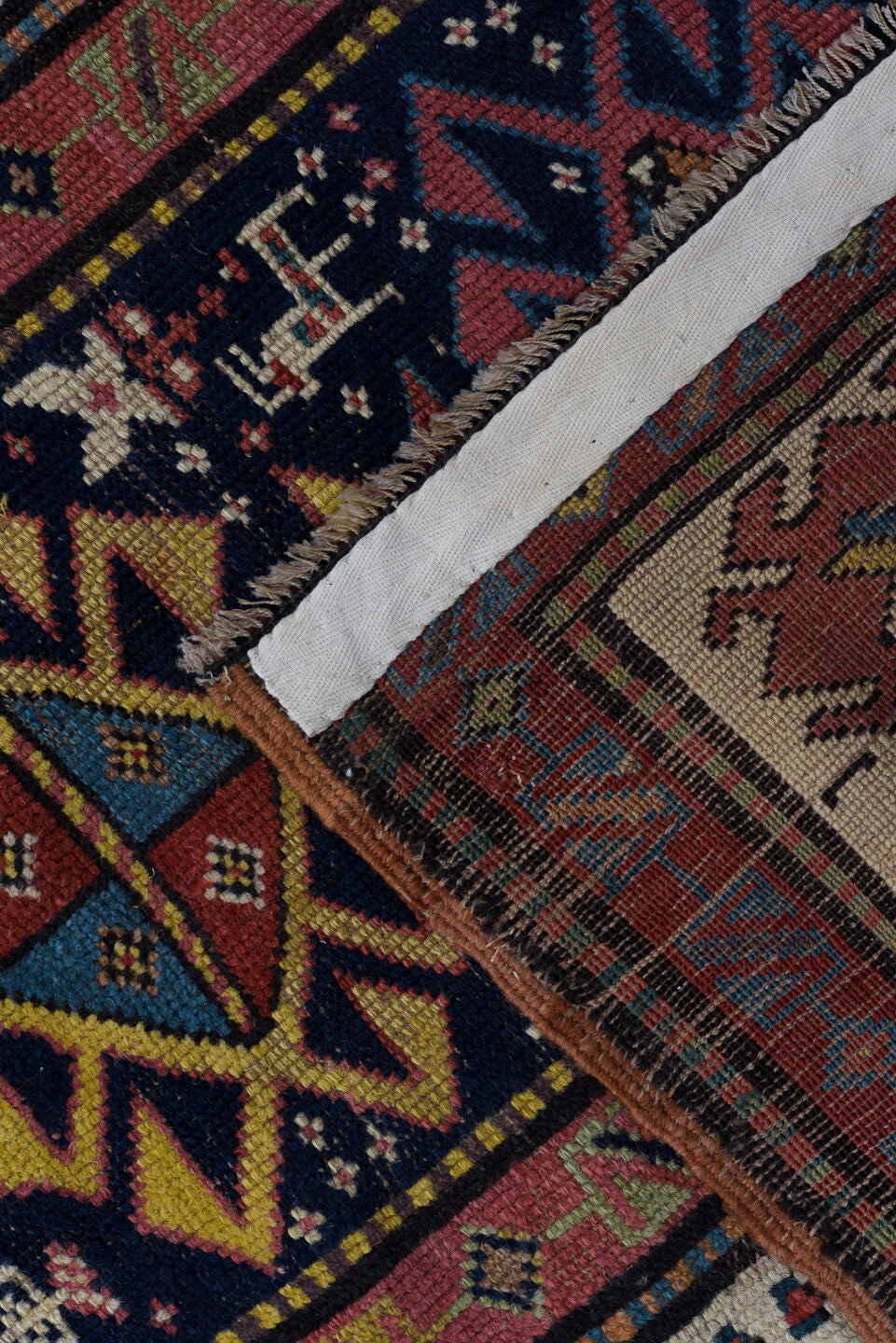 3' x 11' one-of-a-kind handmade vintage Caucasian runner rug. Color palette: black, blue, brown, charcoal, gray, indian red