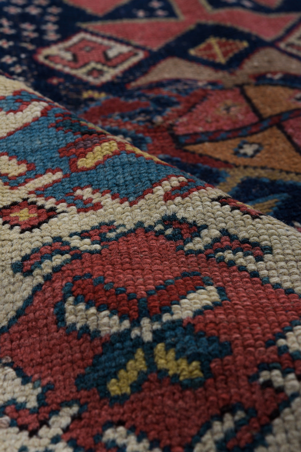 3' x 11' one-of-a-kind handmade vintage Caucasian runner rug. Color palette: navy, ivory, rust, rose, soft blue, taupe
