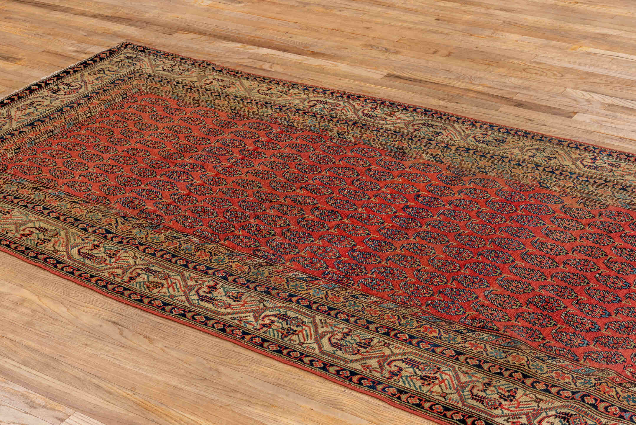 4' x 11' one-of-a-kind handmade antique Saraband runner rug. Color palette: rust, ivory, navy, camel, terracotta, charcoal