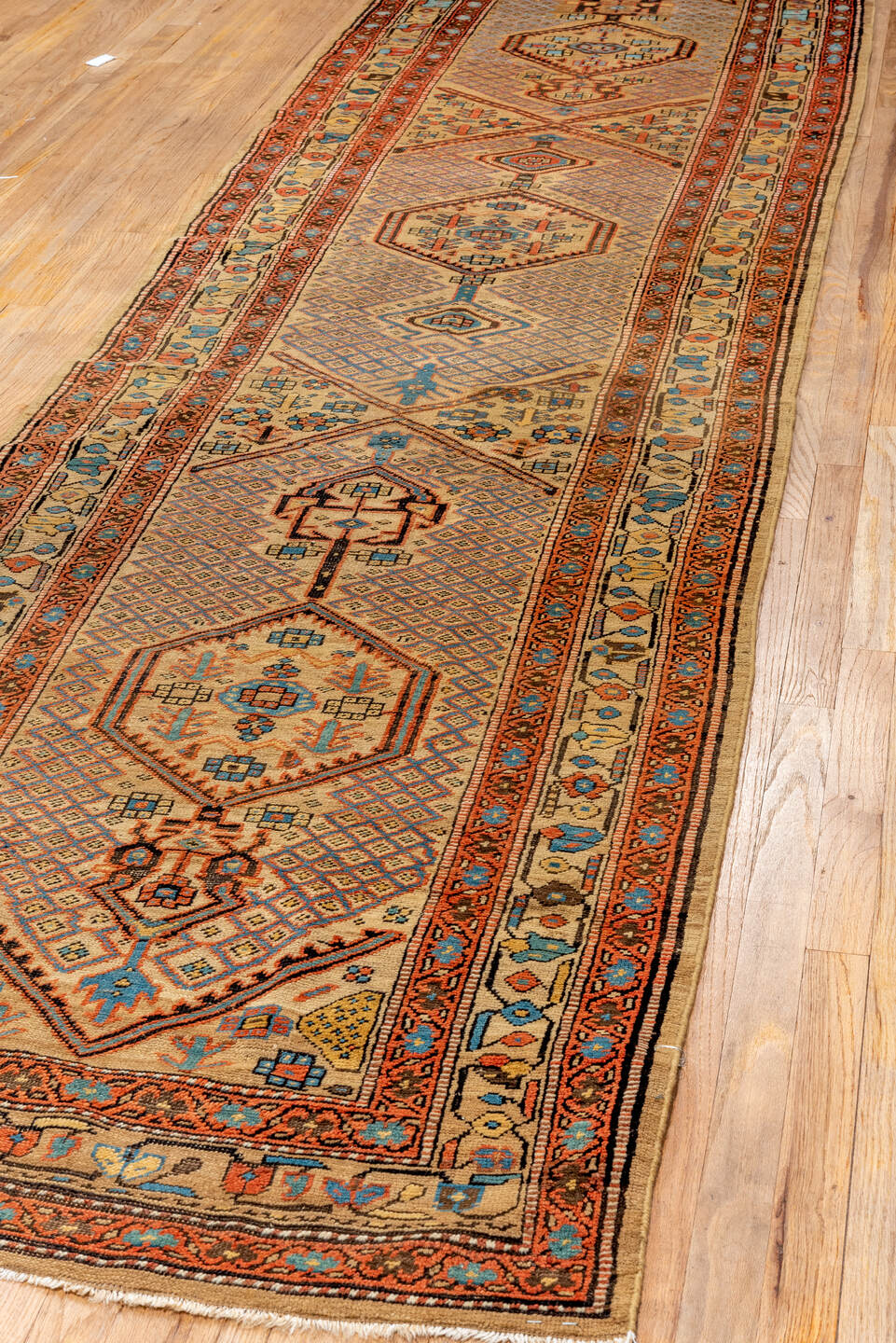 3' x 13' one-of-a-kind handmade antique Sarab runner rug. Color palette: ivory, rust, sky_blue, indigo, camel, terracotta