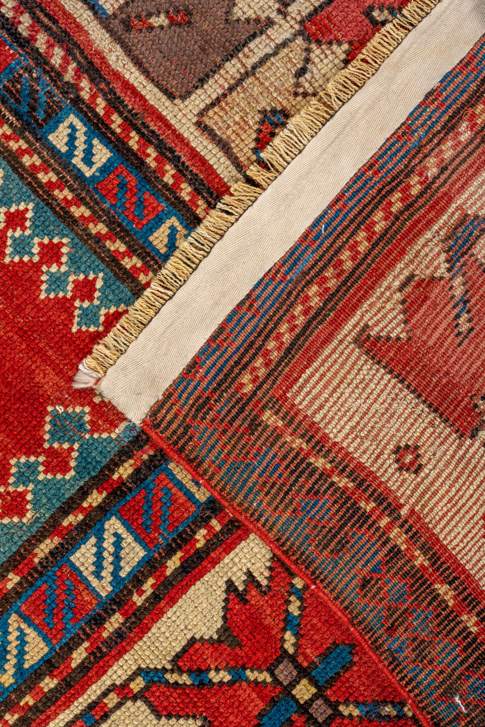 4' x 7' one-of-a-kind handmade antique Kazak rug. Color palette: ivory, red, sky blue, navy, rust, taupe, teal, light blue