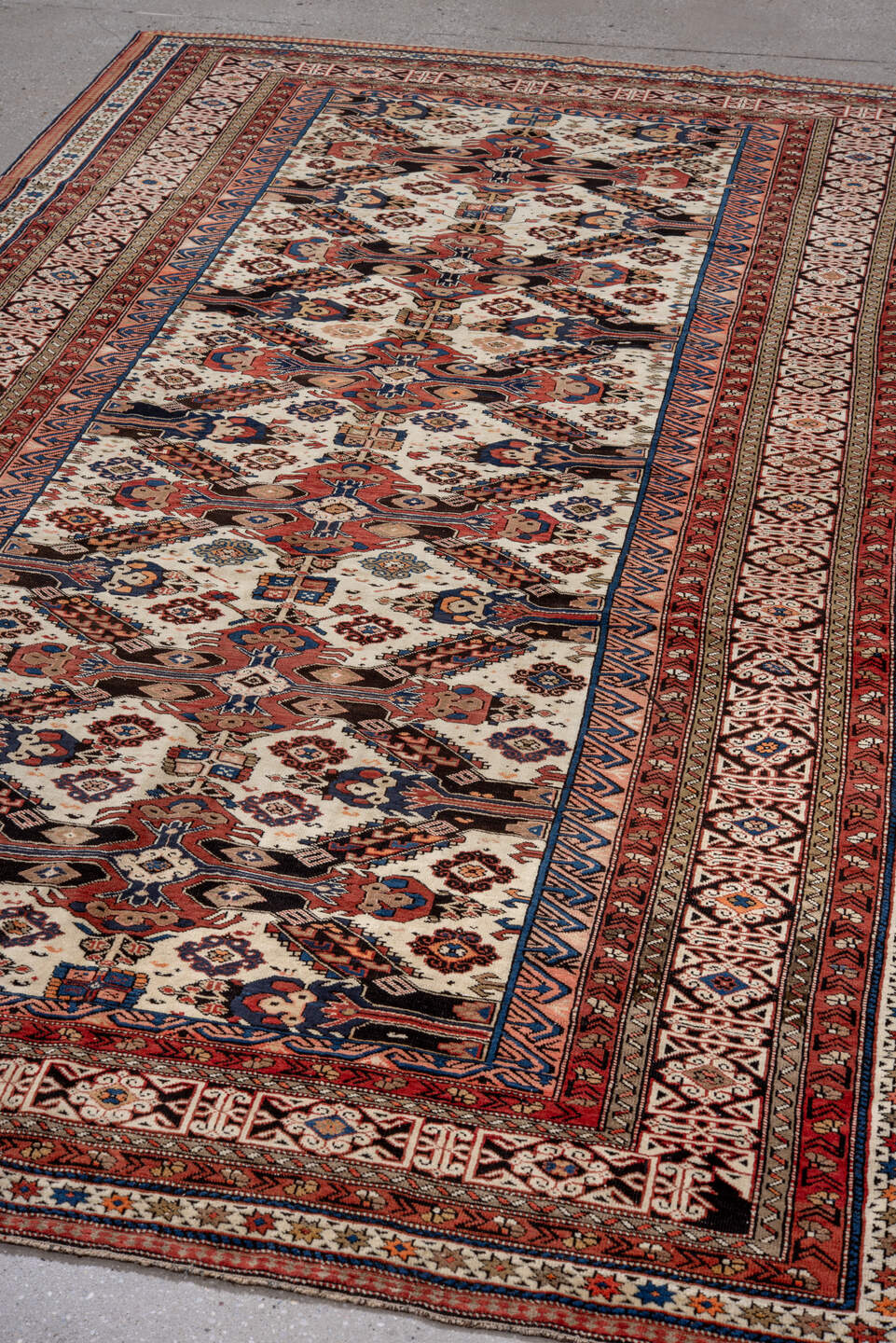 5' x 9' one-of-a-kind handmade vintage Caucasian medium size rug. Color palette: blue, brown, gray, light gray, off-white