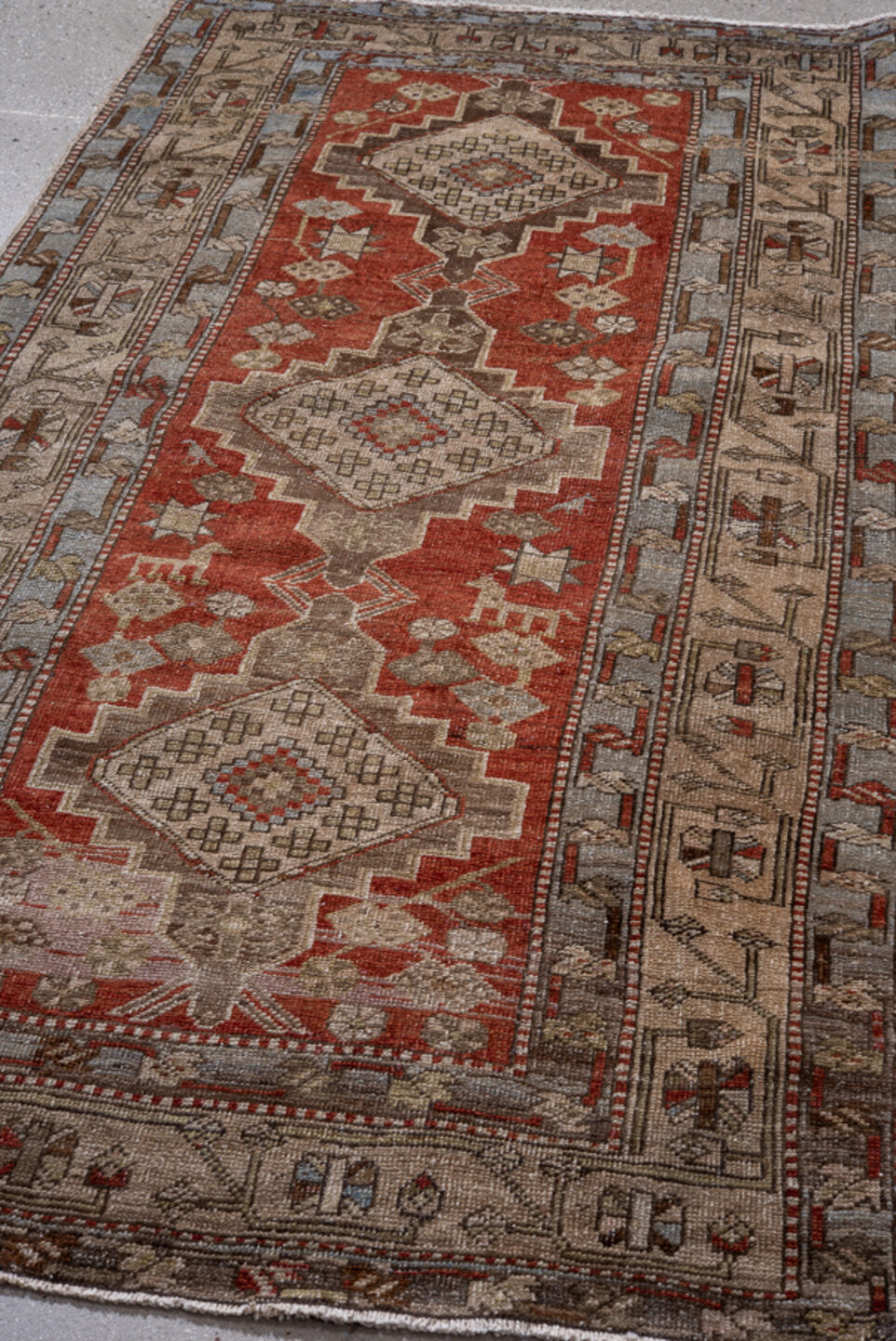 3' x 7' one-of-a-kind handmade vintage Heriz rug. Color palette: blue, brown, gray, light gray, off-white, pink, red