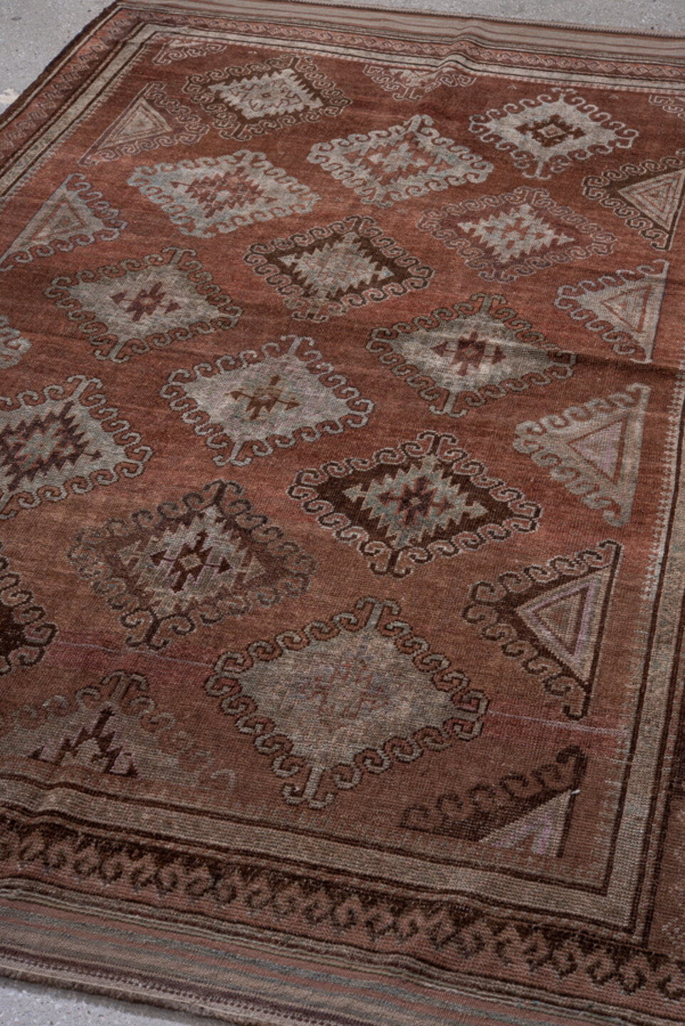 4' x 7' one-of-a-kind handmade vintage Belouch rug. Color palette: brown, gray, pink