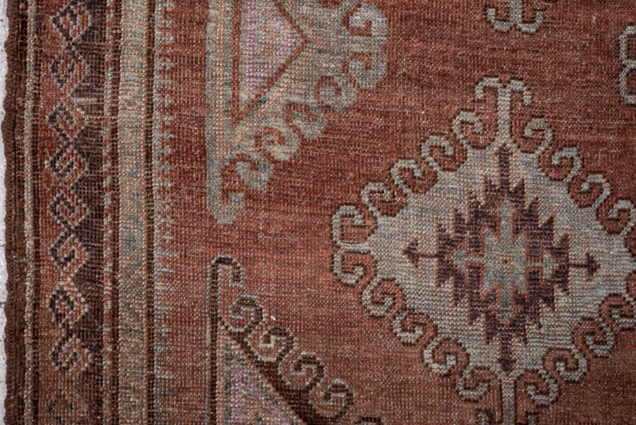 4' x 7' one-of-a-kind handmade vintage Belouch rug. Color palette: brown, gray, pink
