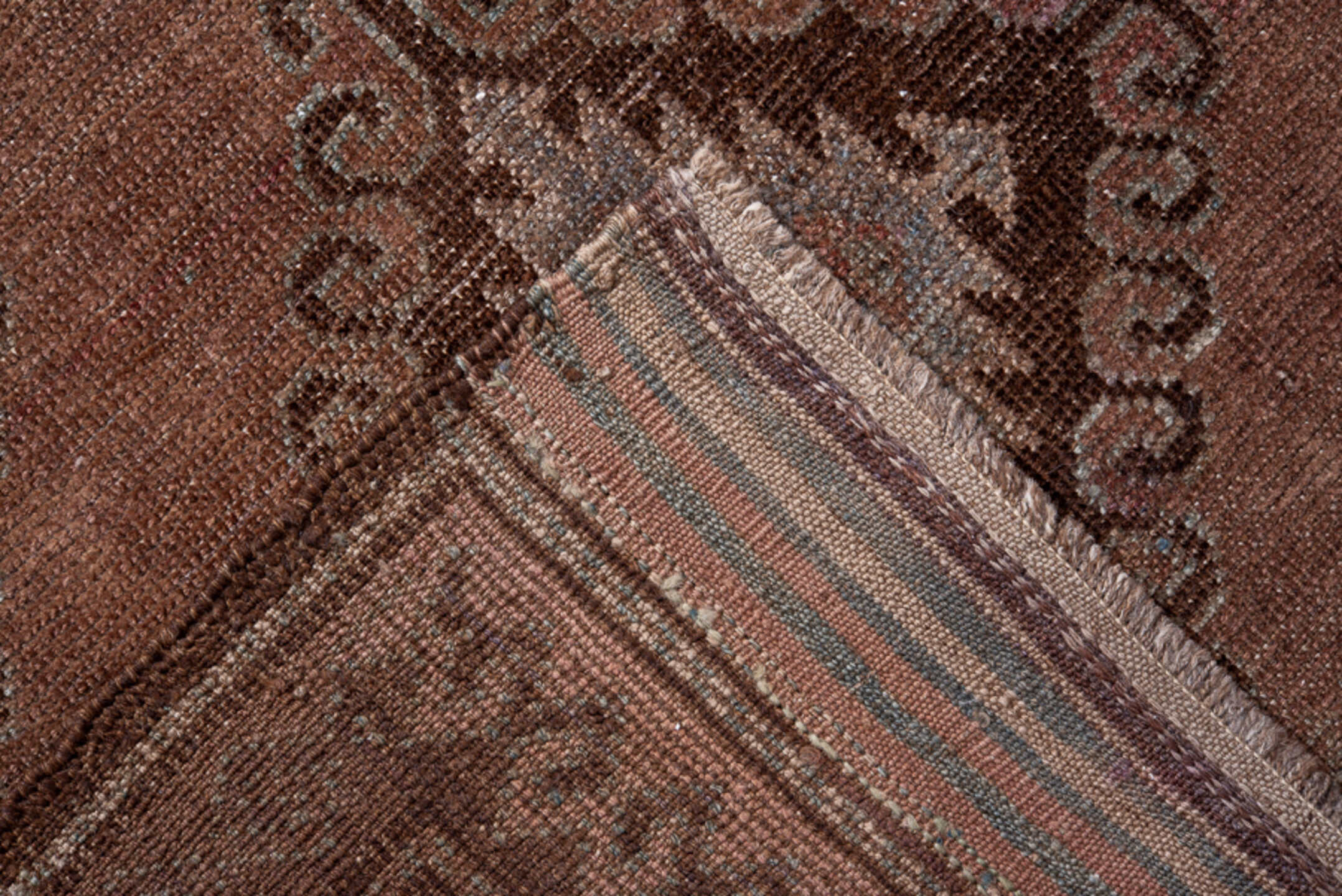 4' x 7' one-of-a-kind handmade vintage Belouch rug. Color palette: brown, gray, pink