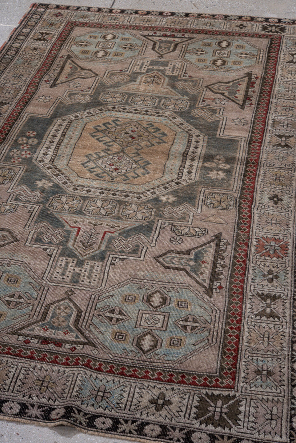 4' x 6' one-of-a-kind handmade antique Shiraz small size rug. Color palette: ivory, charcoal, sky blue, rust, taupe, black